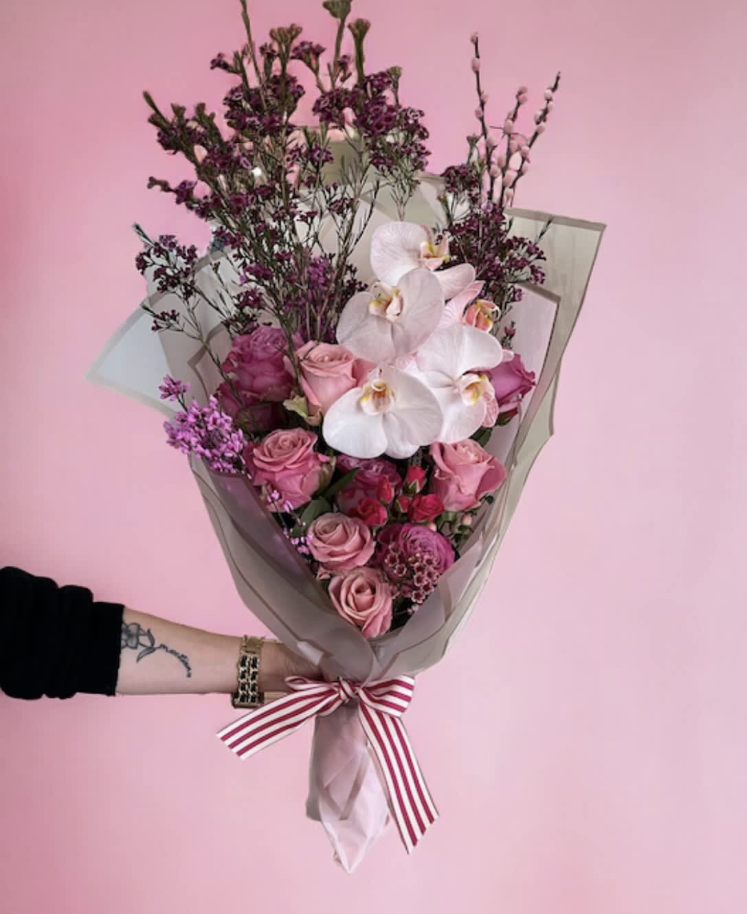 Pretty pink bouquet Pretty pink bouquet - Flower: Shades of hot pink, light pink roses with wax flower mix green touch of orchid