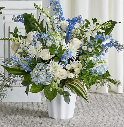 Blessings of Memory Floor Basket - Offer the peace and tranquility that comes from classic blue and white flowers. Our elegant floor basket arrangement, handcrafted by our caring florists with pristine white and blue blooms, is a tasteful gesture perfectly suited for the funeral home or memorial services.