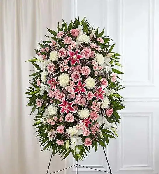 Pink &amp; White Funeral Standing Spray - The warmth and kindness they showed will live on forever, and sometimes this sentiment is best captured through flowers. Our classic standing spray arrangement is elegantly crafted with soothing pink and white blooms for a lush, full presentation, creating a truly memorable tribute to someone so loved.