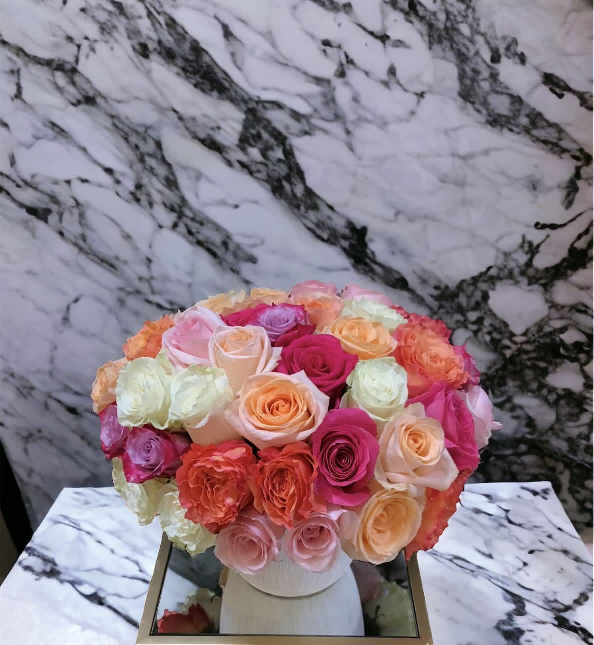 Rose Festival! Rose Festival! - Flower : 75 lush roses in shades of hot pink, blush, tangerine, and cream. Vase : 8” by 8 “ white ceramic vase