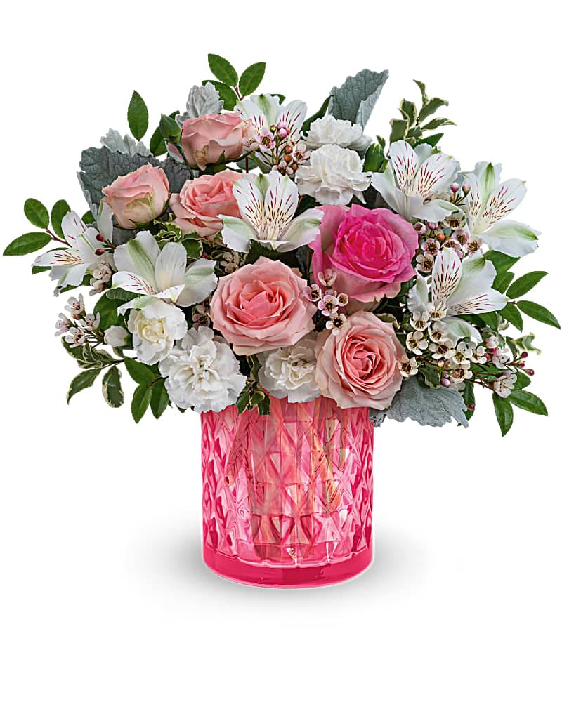 Vintage Vibes Bouquet - Soft and feminine, this vintage-inspired bouquet looks oh-so-perfect in a glistening pink glass vase with delicate diamond pattern. Pink roses, pink spray roses, white alstroemeria and miniature white carnations are arranged with dusty miller, huckleberry, pitta negra and pink waxflower. Delivered in a Vintage Elegance cylinder.  