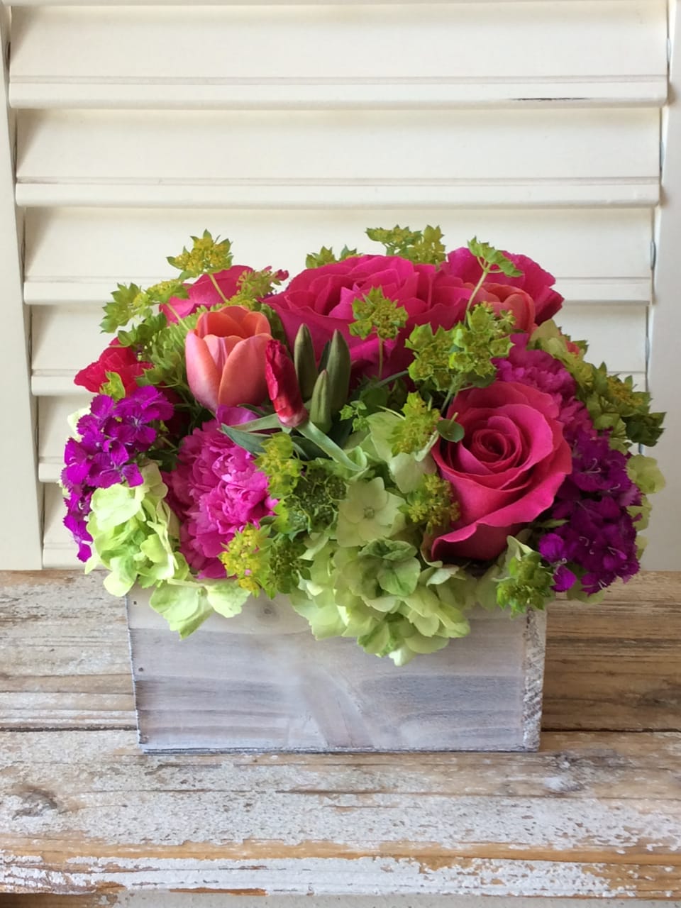 Fresh Beauty - A lush collection of a variety of spring blooms in hot pink and green.  Pave style premium flowers including Hydrangea, Roses, Spider Mums and Tulips are arranged in a 3.5&quot;H x 7&quot;W white wash wooden box - FRESH and BEAUTIFUL!!!  