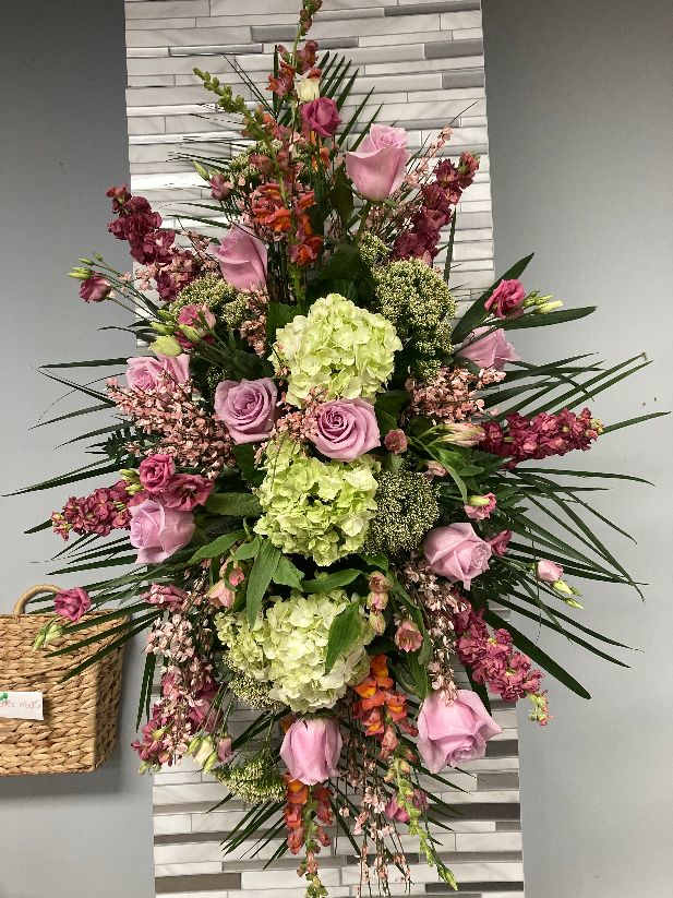 spray- standing - this lovely standing spray which will hang on an easel can be made in different colors, with flowers such as hydrangeas, roses, stock, snapdragon, genestra, trachilium, lysianthius. 