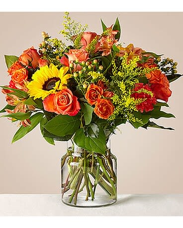 Sunnycrisp Bouquet - The sunny October sky and crisp fall air--find this and more in the Sunnycrisp Bouquet! Joyful sunflowers peek out among the orange, red, and yellow fall blooms to bring happiness to someone you love this season. The airy, wildflower design lets spirits soar on birthdays, anniversaries, or festive fall celebrations.