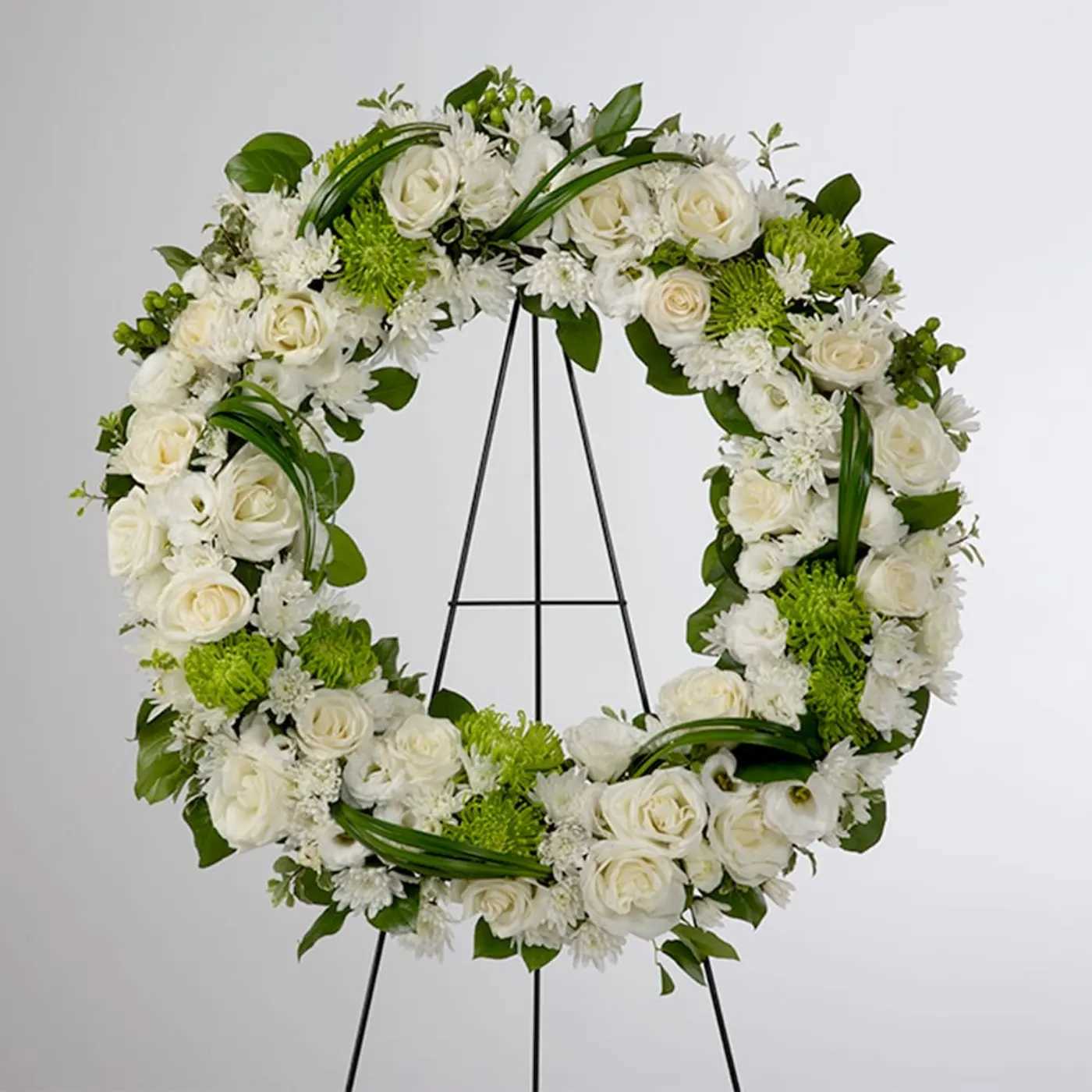 Lasting Serenity by BloomNation™ Lasting Serenity by BloomNation™ - A beautiful white and green tribute wreath that calms, this easel arrangement celebrates a full life and a peaceful passing. Deluxe shown $300.00