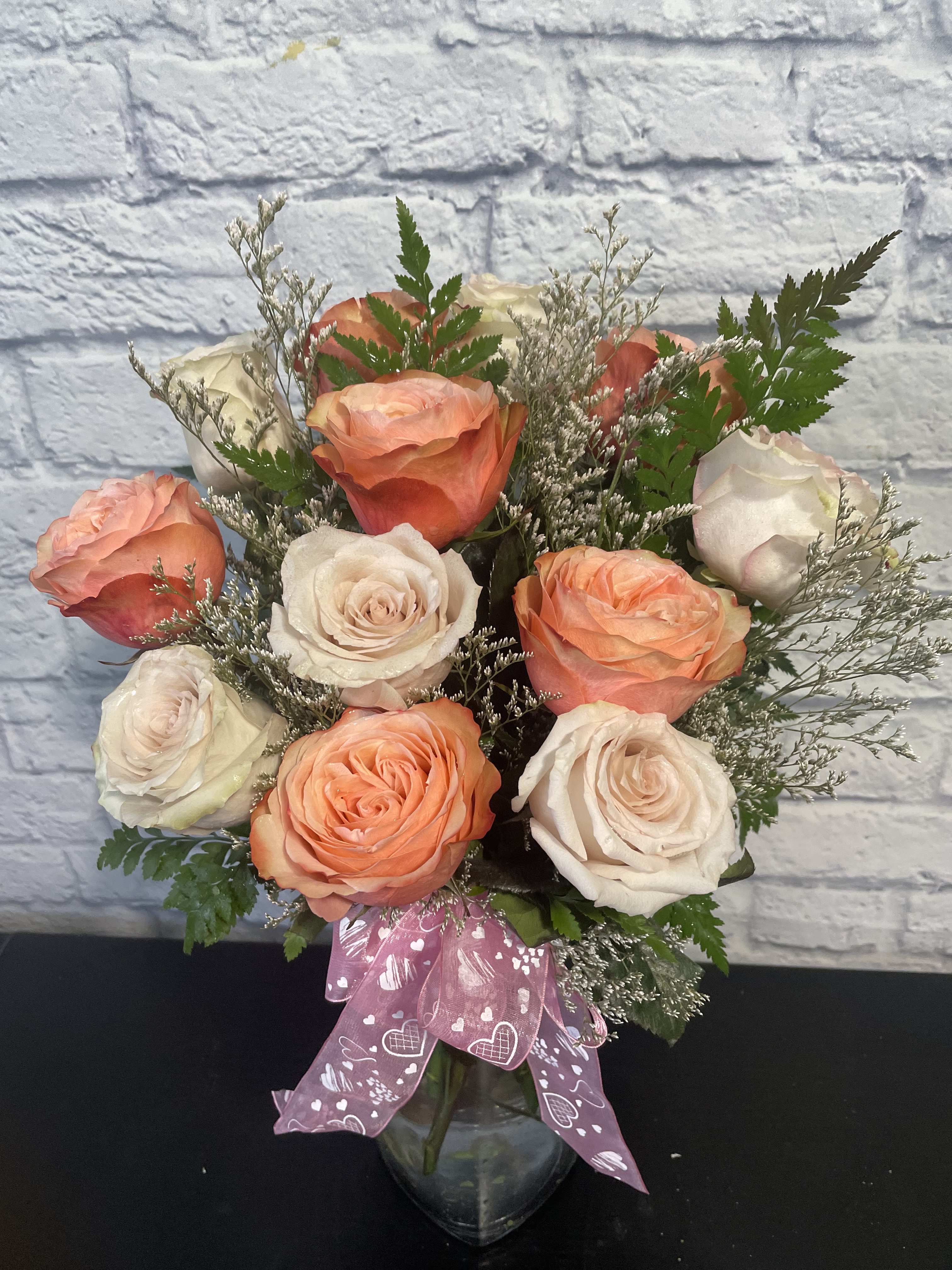 1 dozen asst colors roses - You'll receive a lovely vase filled with 1 dozen (any color roses, NOT RED) with fillers and greenery. A fun surprise for someone who loves roses.
