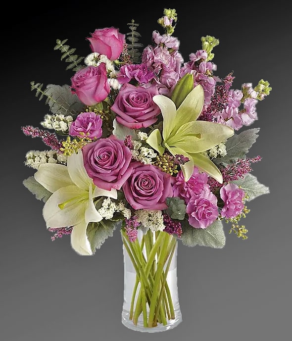 Purple Elegance Flowers - This elegant bouquet full of roses, lilies and stock is a stylish way to send love for the start of spring, a birthday, or just because. You will make your recipient's day with this fresh floral arrangement. Hand-delivered in a clear glass vase by a local florist.