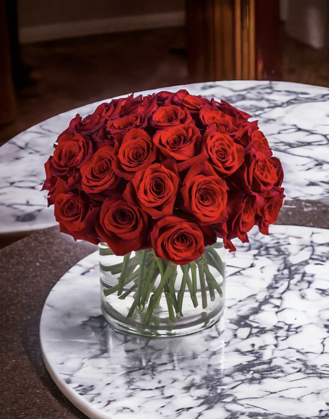 Three Dozen Red Roses by BloomNation™ - Make a bold statement with this beautifully simple design. Three Dozen Red Roses by BloomNation™ is the perfect gift for Valentine's Day, an Anniversary, or when anytime you're feeling romantic.   Arrangement Details: Three dozen red roses in a glass cylinder vase.  APPROXIMATE DIMENSIONS are 12&quot;D X 12&quot;H 