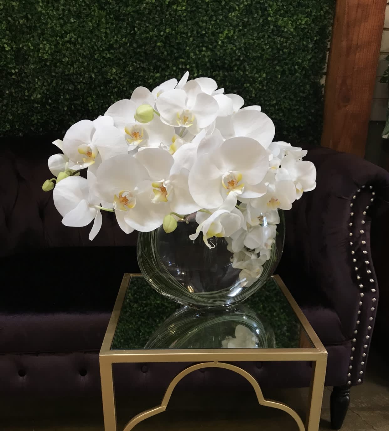 Lovely White orchid  - Flower : Elegant white phalaenopsis orchids spill out over the top of a 8” by 9” clear glass vase.