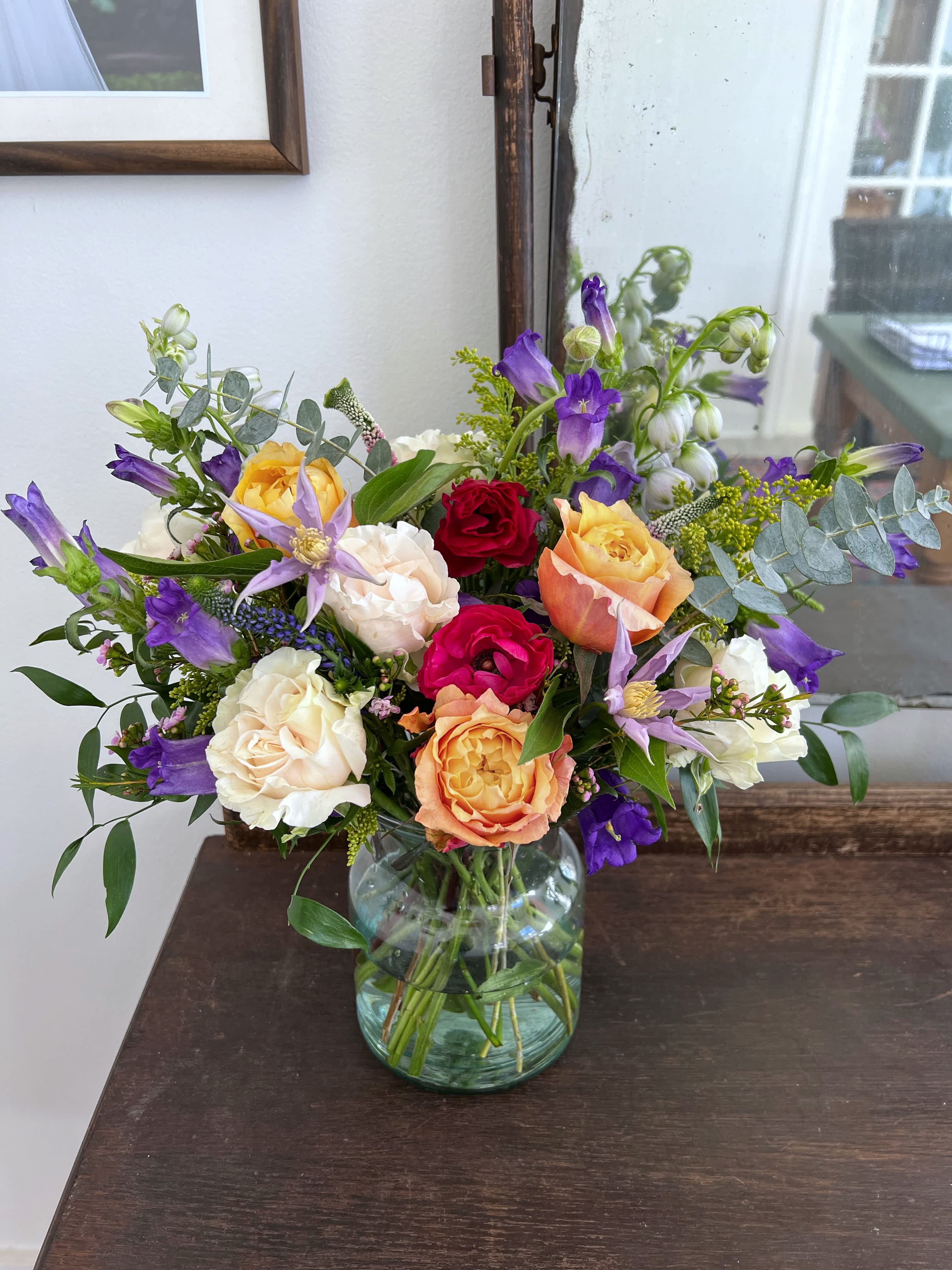 Spring Celebration - Perfect for that brunch or dinner party! The pastel color pallet screams spring! Arranged tall with the freshest in season florals.