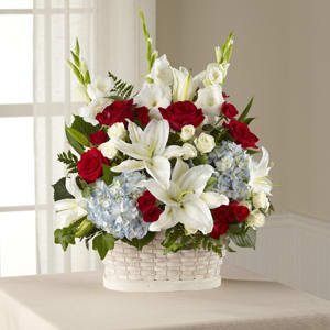 The FTD Greater Glory Basket - Appropriately sized for funeral home viewing, a white basket will be filled with lush hydrangea, roses, spray roses, lilies and gladiolus. A dramatic tribute for a loved one lost. 