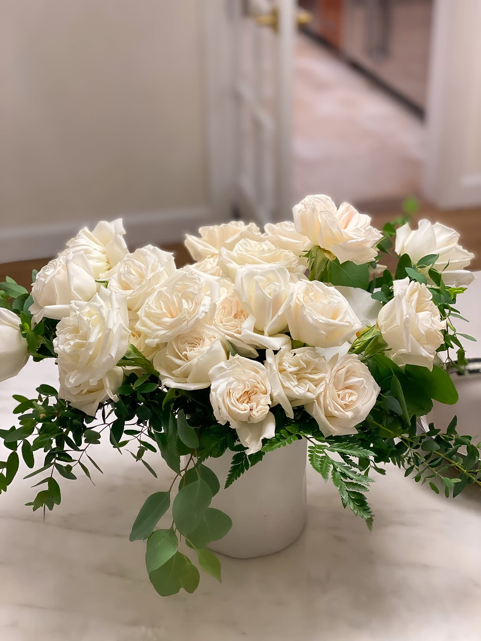 12White roses in vase - Standard- Your order will be arranged approximately as shown on our website. 