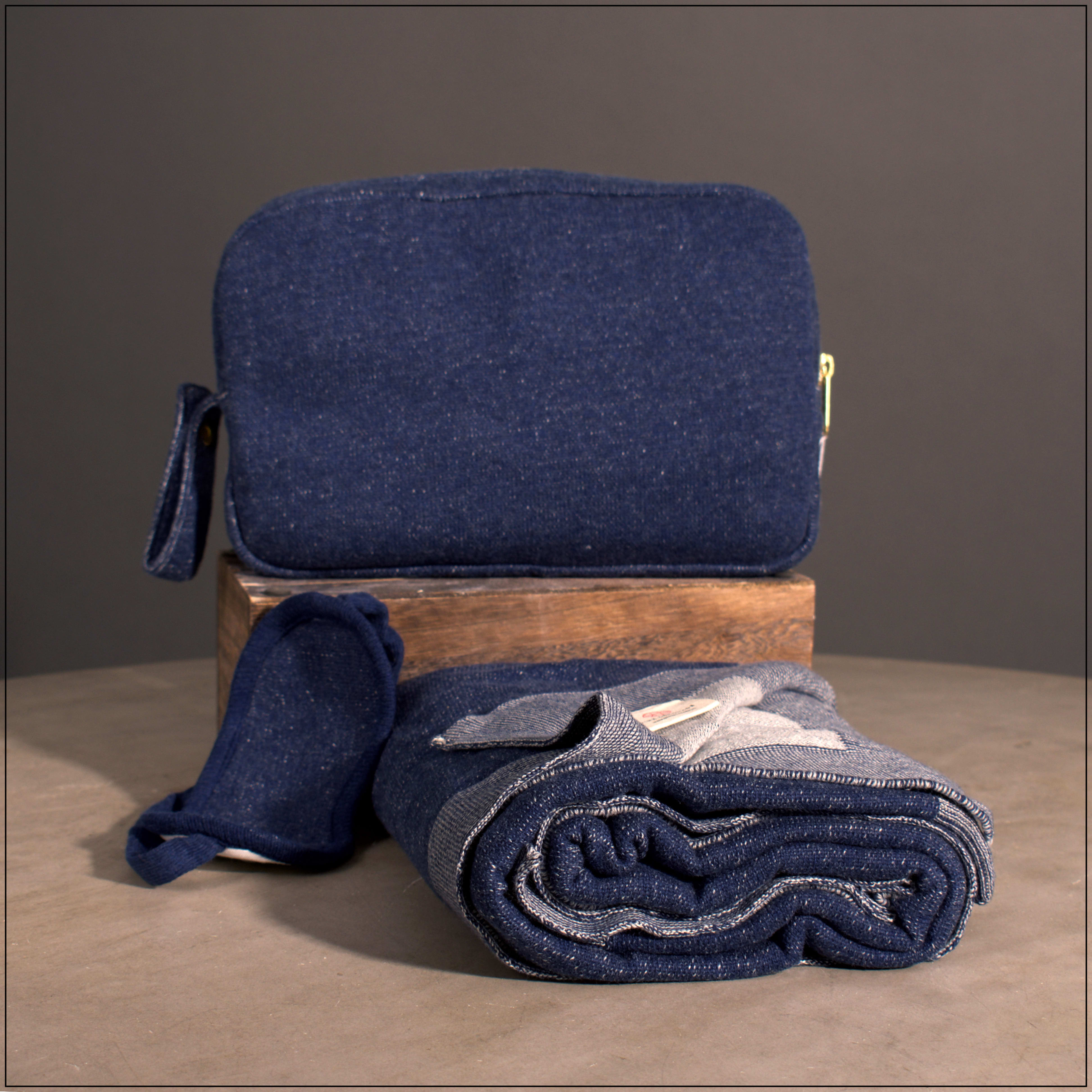 Navy Travel Blanket Set - Pink Lemonade’s 100% Cotton Travel Blanket Set is the perfect accompaniment for your next exploration. 100% pure Cotton blanket feels amazing against your skin and offers extreme softness and warmth. This luxury travel set makes a wonderful gift for a traveler.  Excellent wedding present for newlyweds to take on their honeymoon. These luxury travel accessories can be used anywhere – great for train and car travel and makes a precious and thoughtful present for on the go friends and family. Each set includes an incredibly soft blanket, coordinating eye mask and carrying pouch.  Size 40 inches x 60 inches  Fabric 100% Combed Cotton Azo-free OEKO-TEX Certified MADE IN INDIA