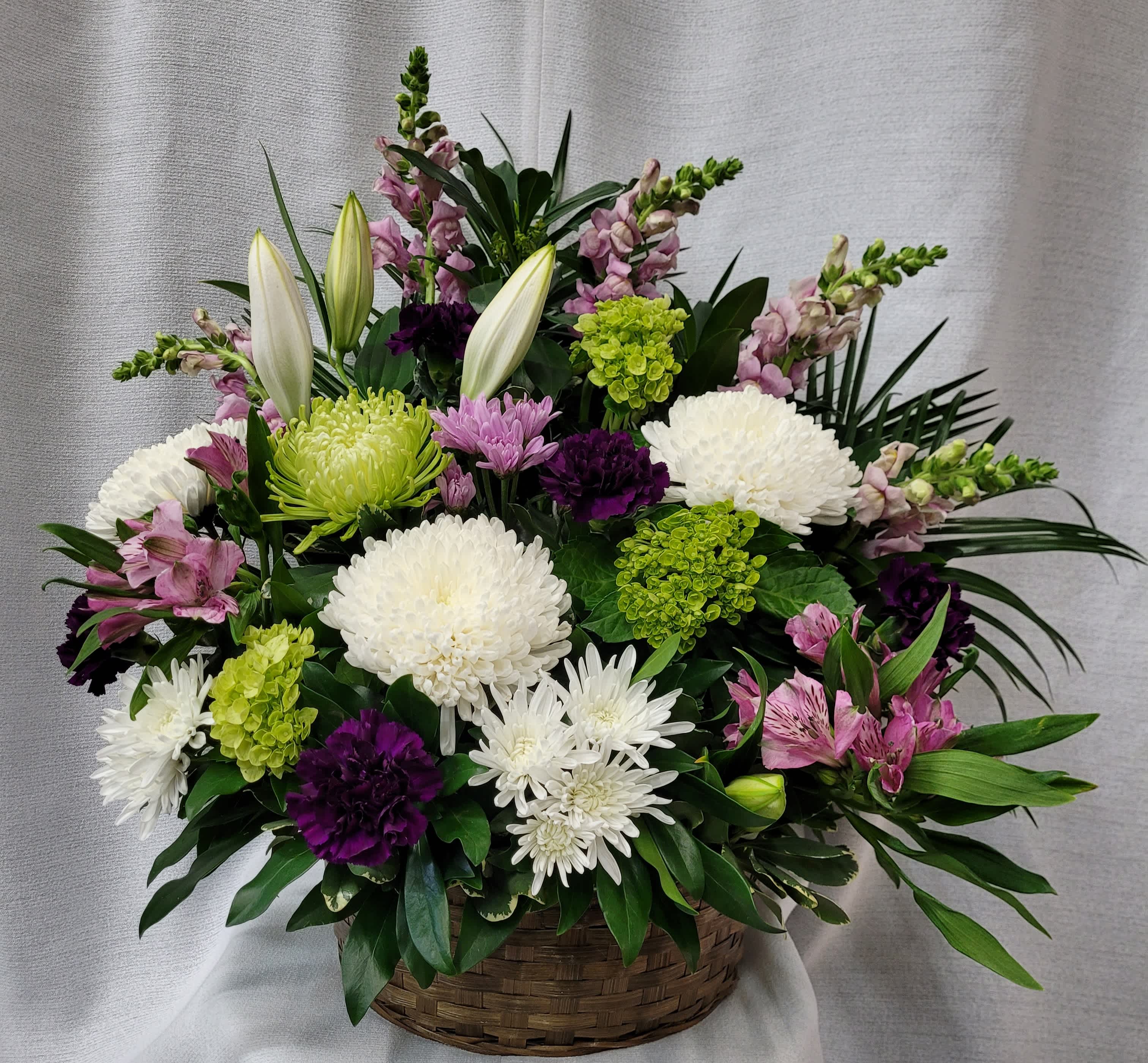 Beautiful Tribute  - This basket is filled with snapdragons, hydrangeas, mums, carnations,  daisies and alstromeria. 