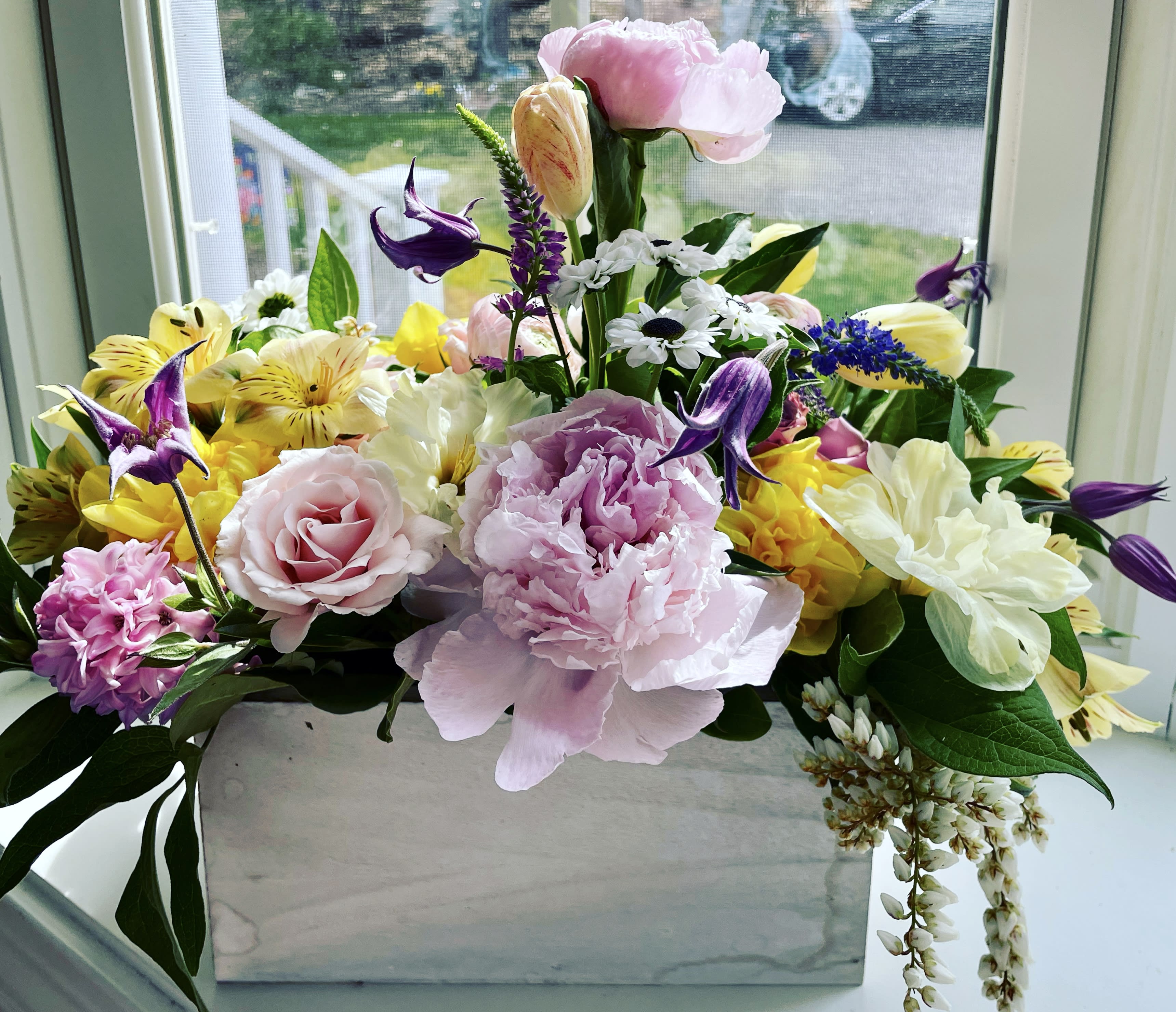 Mothers Day Garden Arrangement in 3 sizes Mothers Day Garden Arrangement in 3 sizes - Mothers Day Arrangement in a 8" white wooden box. Perfect for your Mom who loves gardening Flowers include hydrangea, roses, snapdragons, stock and more