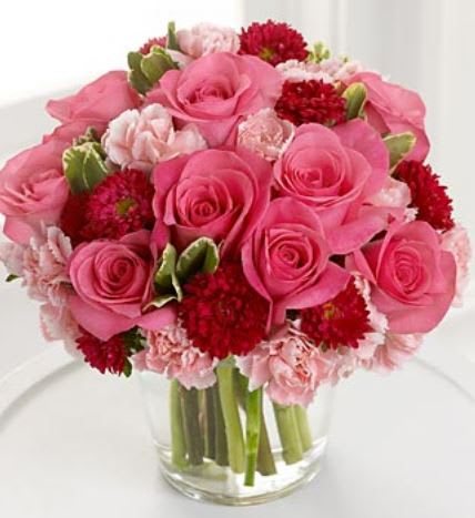 Pinkie to Do  - Pink rose, carnations and pitto varg. throughout  Delivery minimum is $50.00 Our DELIVERY SERVICE IS TILL 3 PM We cannot guarantee requests for a specific time of delivery. There might be flower substitutions, due to low supply of certain flowers. However, we do our best to provide you with the same look and feel of the arrangement. Our main goal is to always give our customers quality flowers and service. To make sure that you get the exact same flowers, ordering a few days ahead of desired delivery date is key.