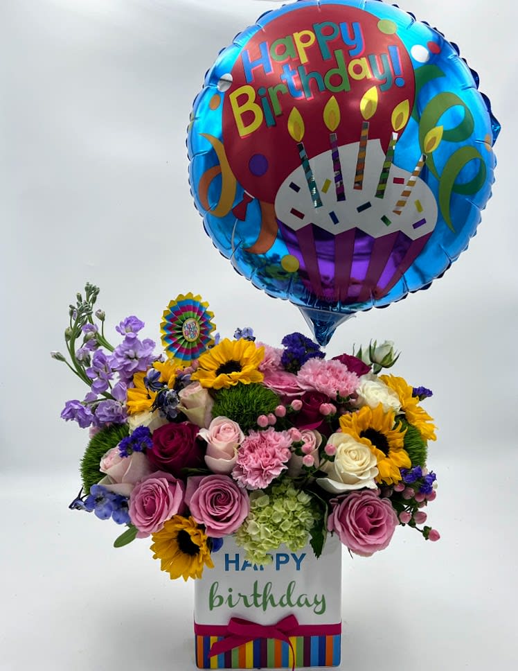 Let's celebrate Let's celebrate - when it's your day it's all about celebration! Let's celebrate a box full of a gorgeous mix of flowers with a bright happy birthday ceramic vase and a Happy Birthday Ballon. max out on celebration!