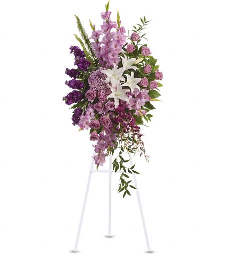 Lavander Garden  - Blessed, peaceful rest is expressed in this cascading purple spray accented with white lilies. Such graceful grandeur would honor a memorial service. Peaceful blooms such as lavender roses, gladioli and hydrangea, with purple orchids and white oriental lilies.