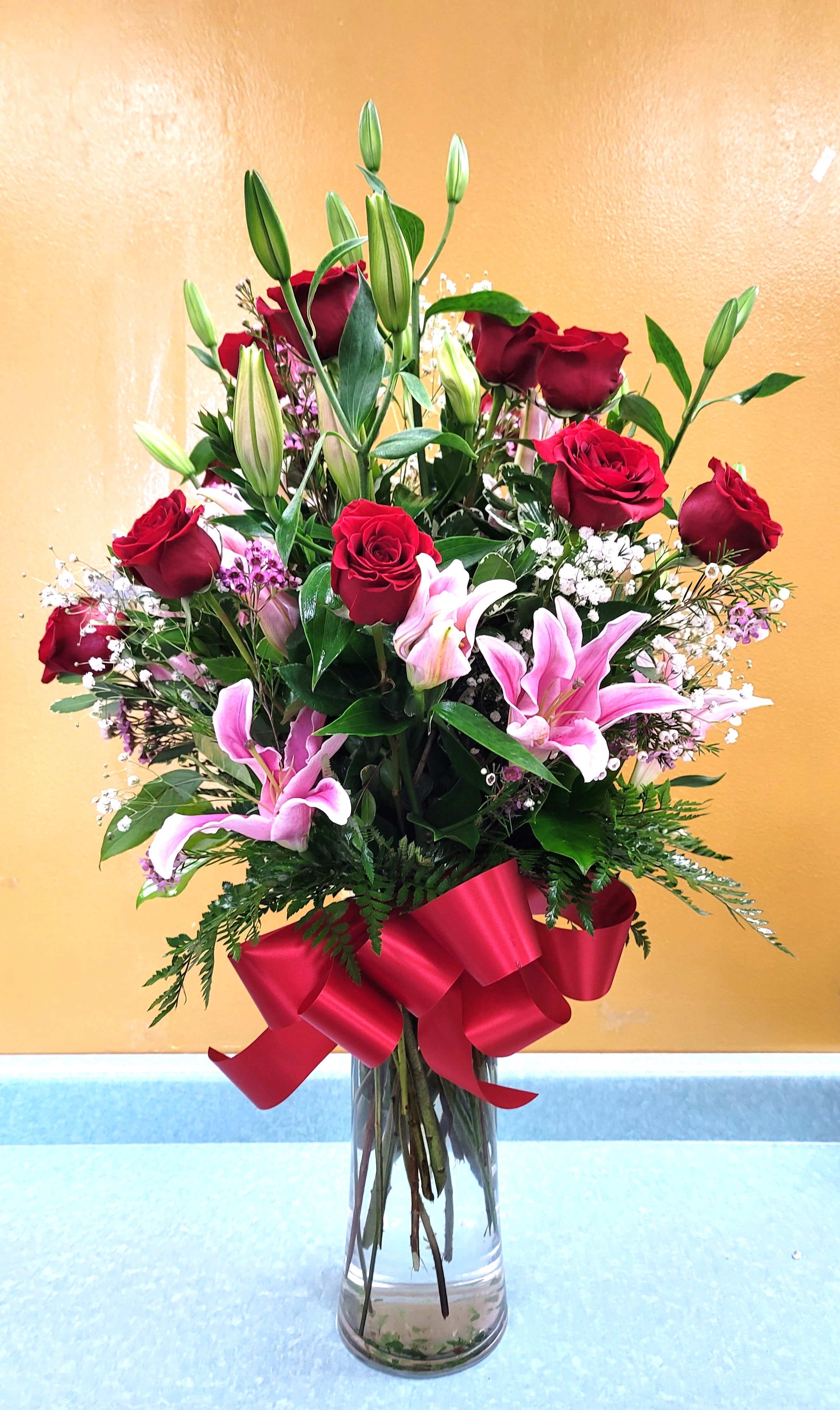 12, 24 OR 36 PREMIUM RED ROSES WITH STARGAZER LILIES  - BEAUTIFUL ROSE ARRANGEMENT WITH STARGAZER LILIES.  YOU CAN ORDER 12, 24 OR 36 ROSES.