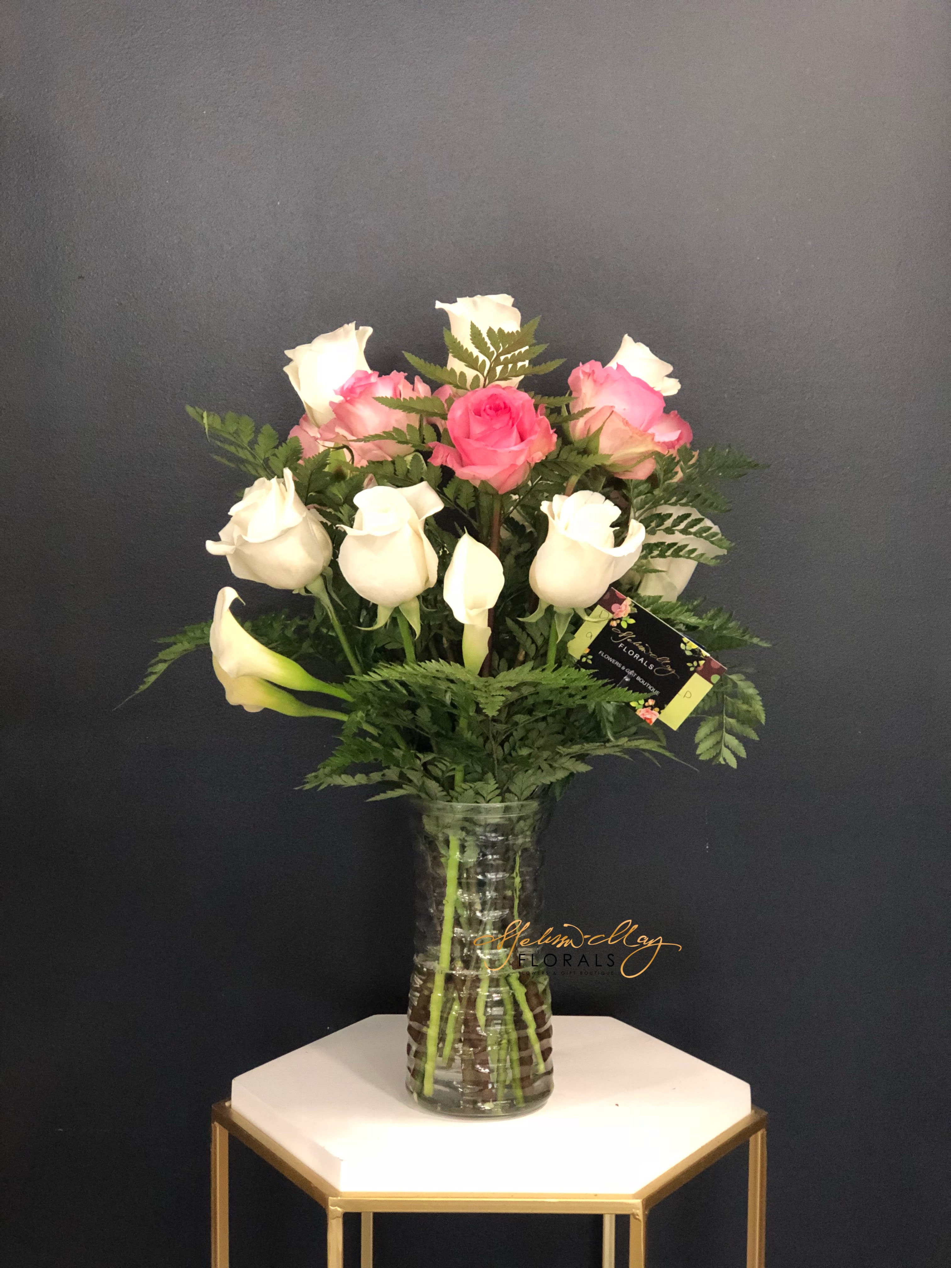 Fantastic Twelve  - Its just one of those days you want to show someone appreciation for all they have done by sending them the Fantastic Twelve arrangement. It consists of three pink roses and 5 white roses, and 4 mini calla lilies.  