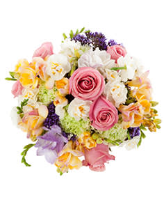 Pastel Wedding Bouquet Pastel Wedding Bouquet - Pastel wedding bouquet comes in 3 sizes and includes freesia, hydrangea, and roses. Colors and floral selection can be customized. Image Courtesy of Flower Shop Network
