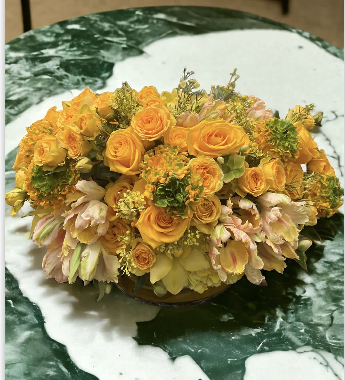 You are my sunshine  - The arrangement including all shades yellow flowers mix, all complemented by yellow tulips, yellow wax flowers , yellow spray roses and soft yellow hydrangeas, yellow orchids. Vase : 5” *10” low clear vase  