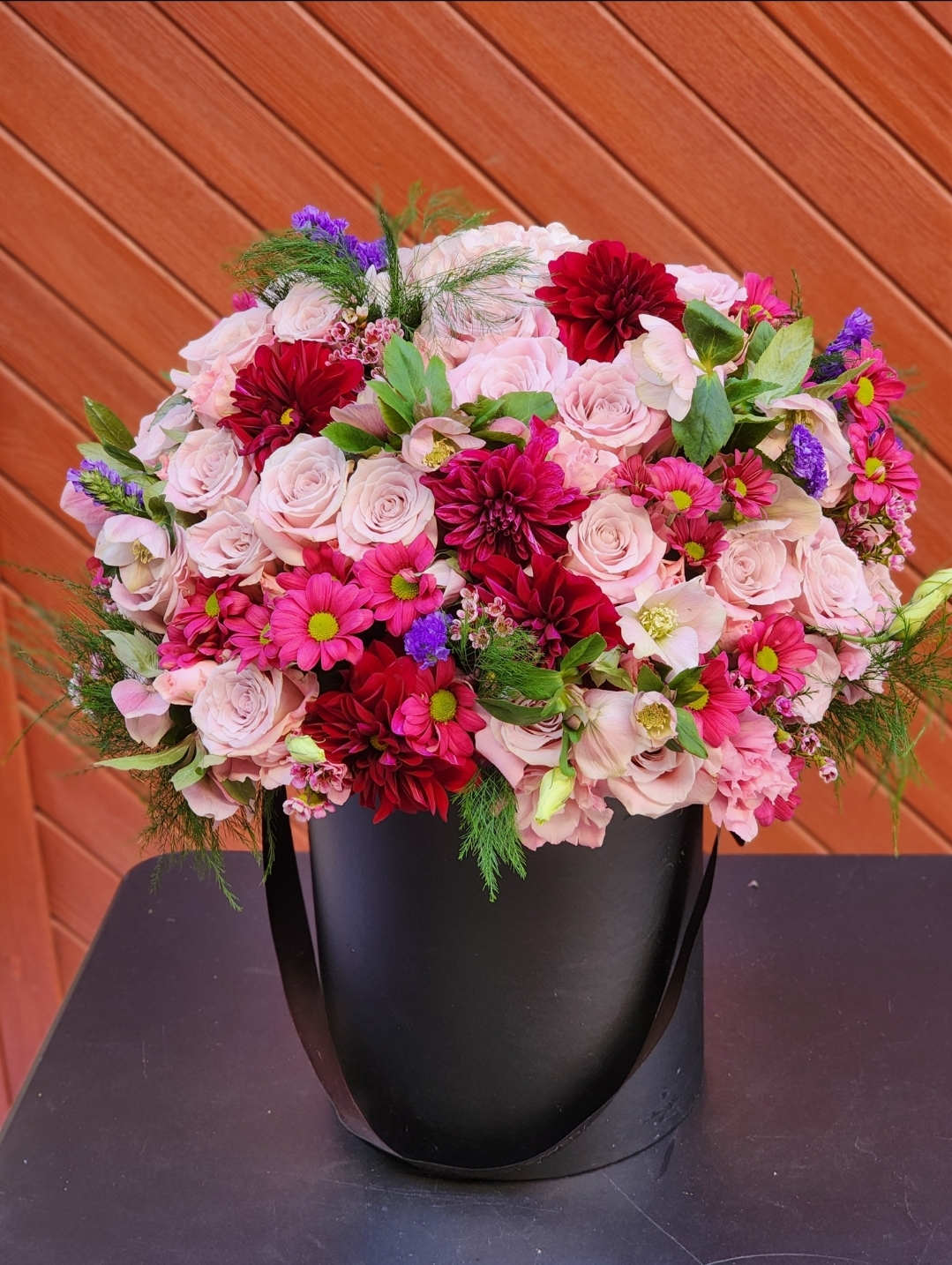 Mystic Flowers  - The vibrant hues of pink against the pristine white box evoke a sense of elegance and modern beauty, making it a tasteful and eye-catching arrangement.