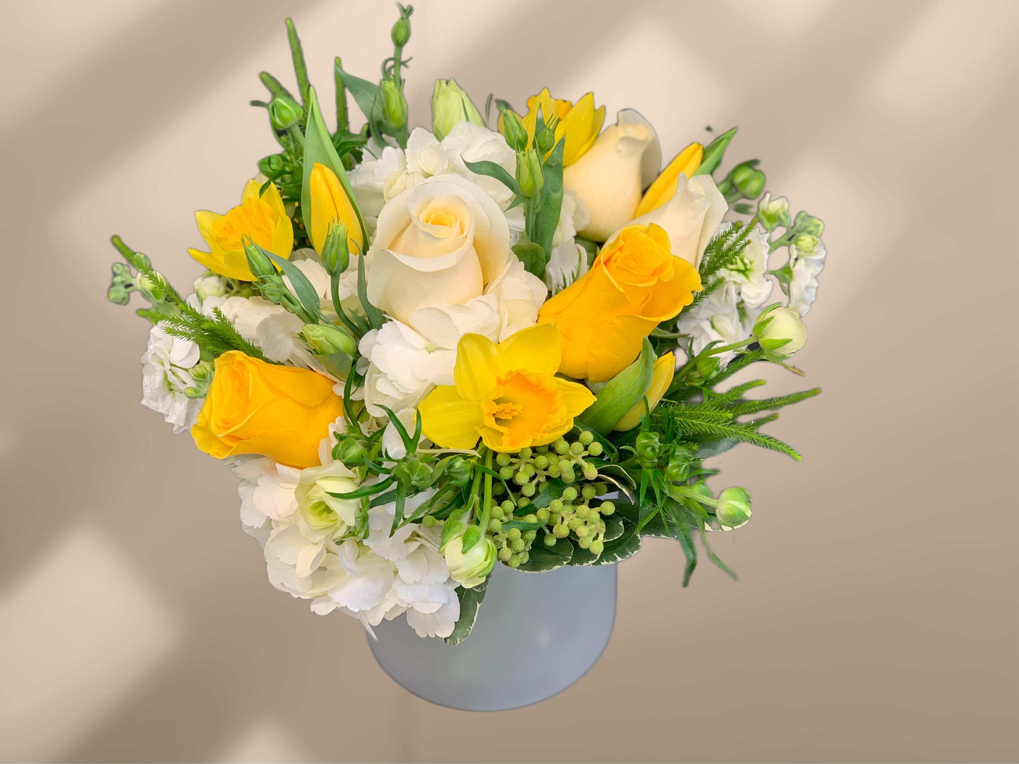 Limoncello - Beautiful white and yellow blooms accented with greenery 
