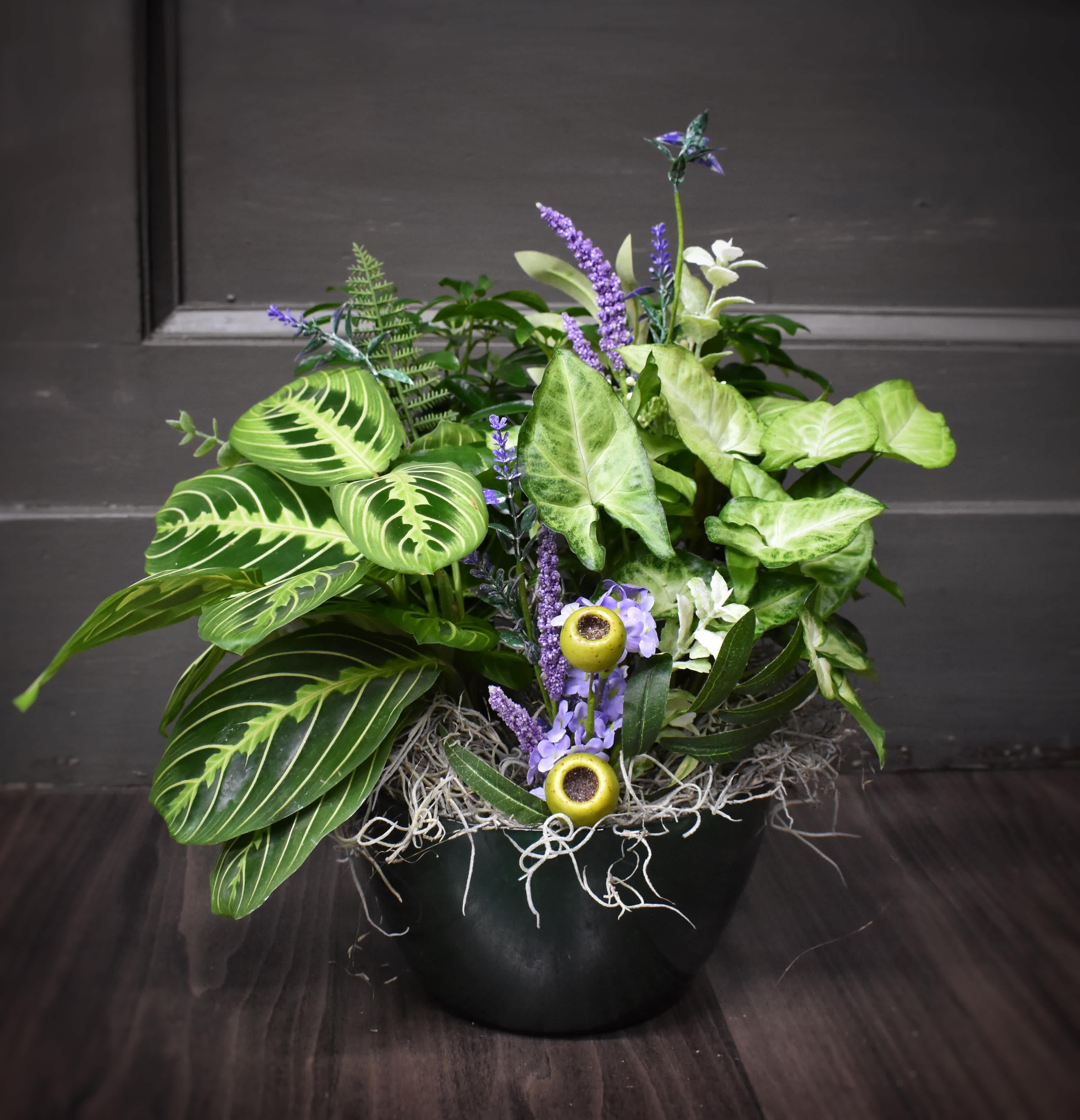 Staying Olive Dishgarden - We've created this tabletop dishgarden using a beautiful colored glass bowl and filling it with lush green plants and accented with silk flowers.