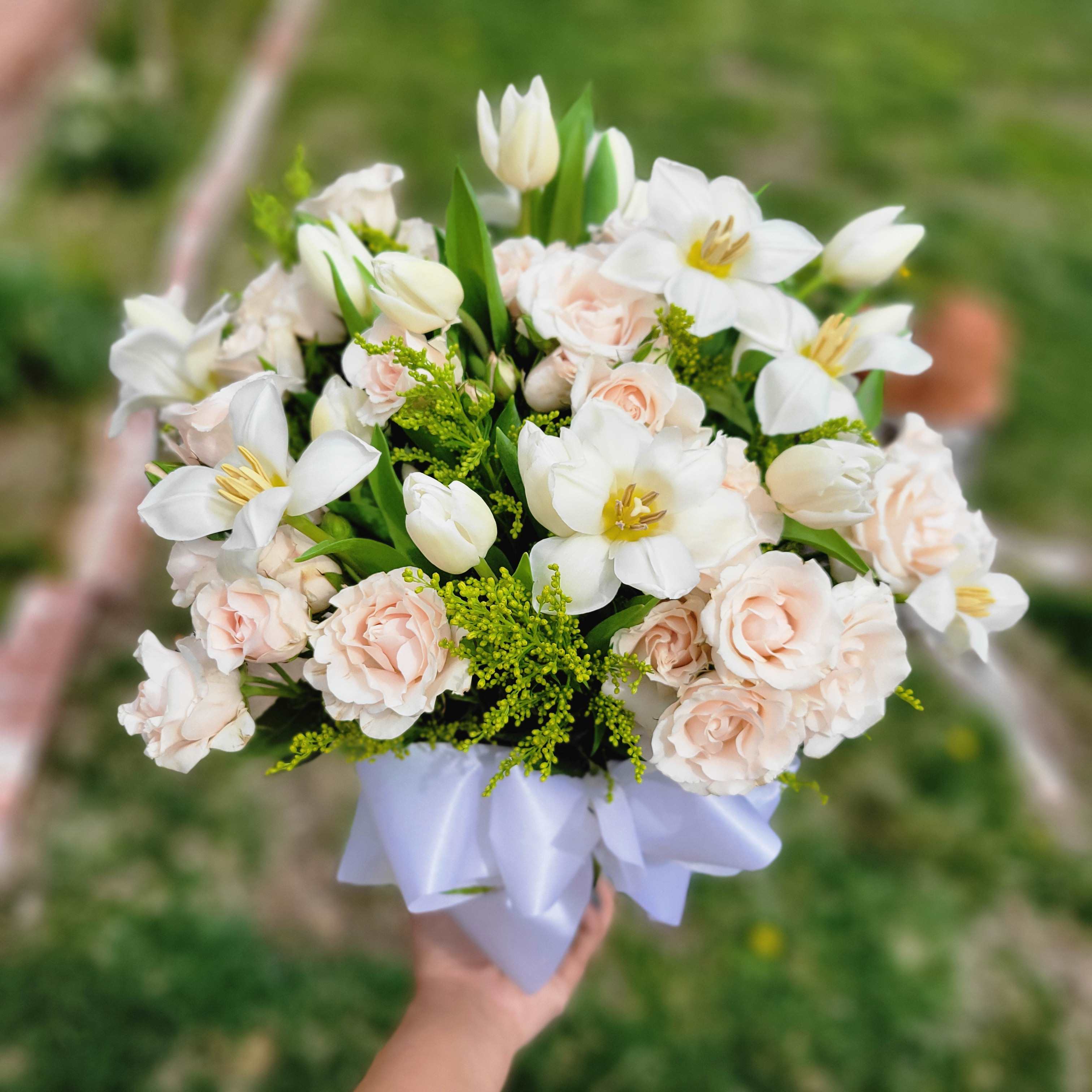 thinking of you - as sweet arrangement of white Tulips and Spray roses!