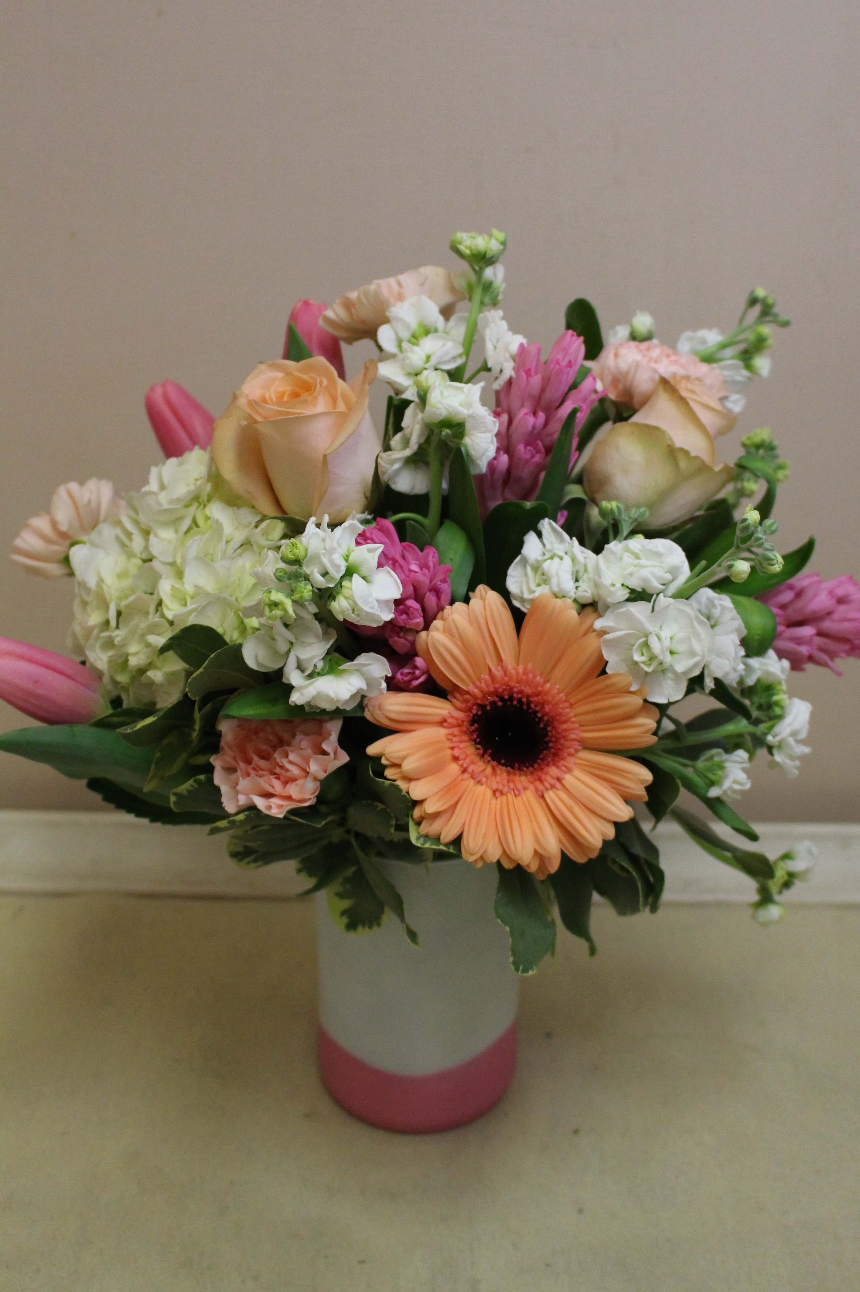 bubble gum dreams - peaches and deep pinks fill this vase.  tulips and hyacinth, gerberas and more