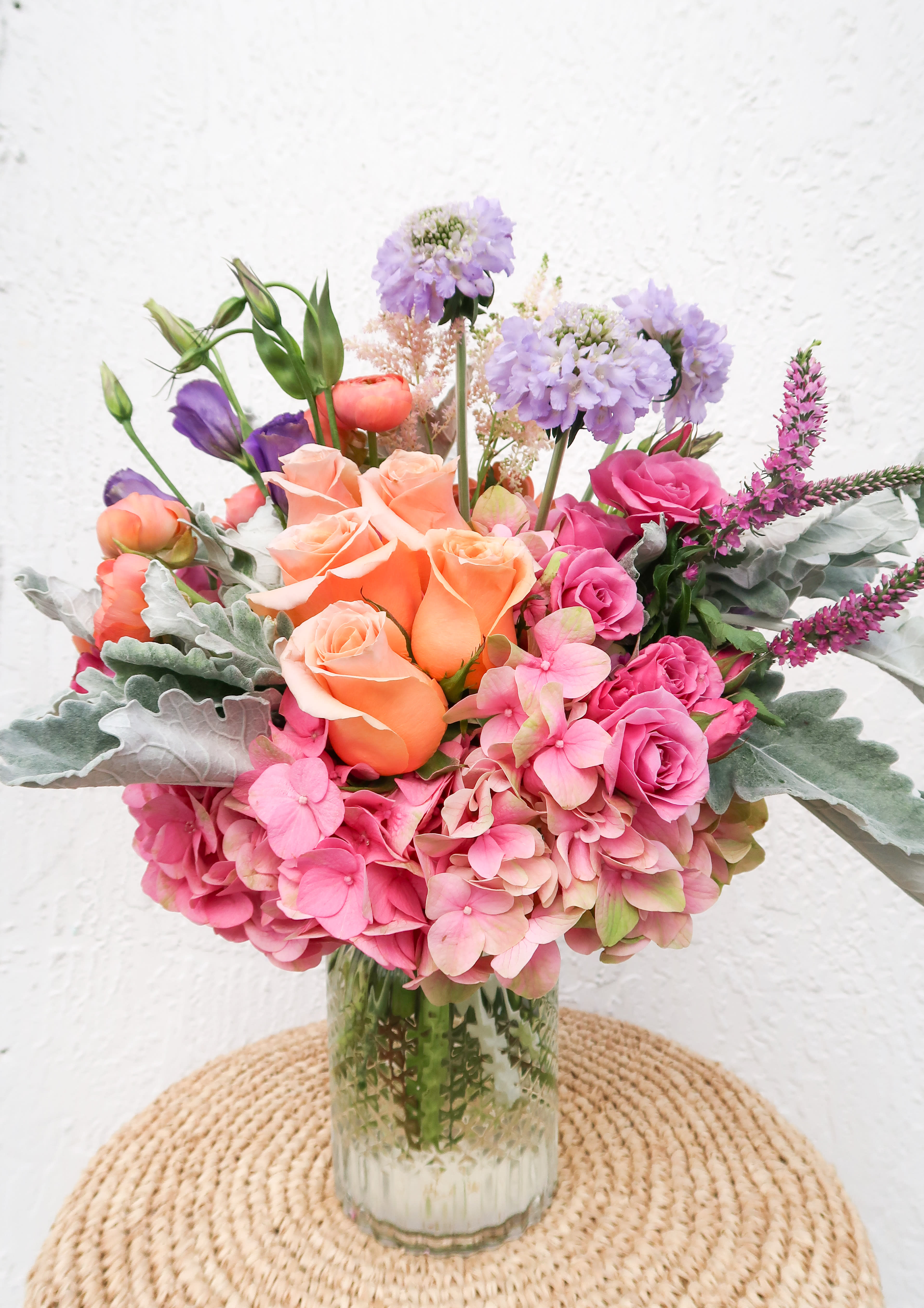 Pop of Color  - Brighten someones day with a pop of color! Perfect for all occasions. This arrangement if filled with the seasons favorite blooms. 
