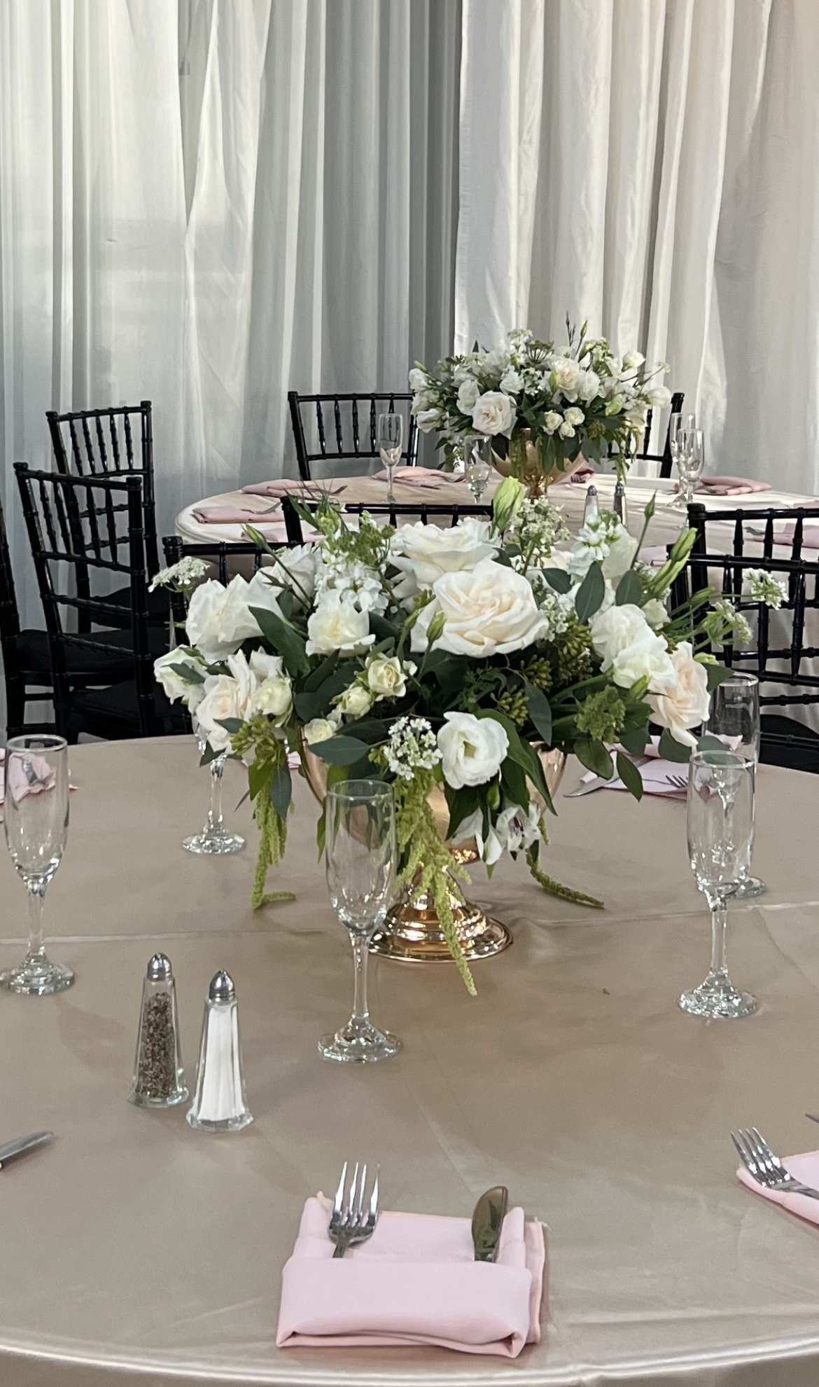 White Coupon Center Piece. White Coupon Center Piece. - White Flowers, Greenery, Eucalyptus Leaves, and a Large Gold Coupon.