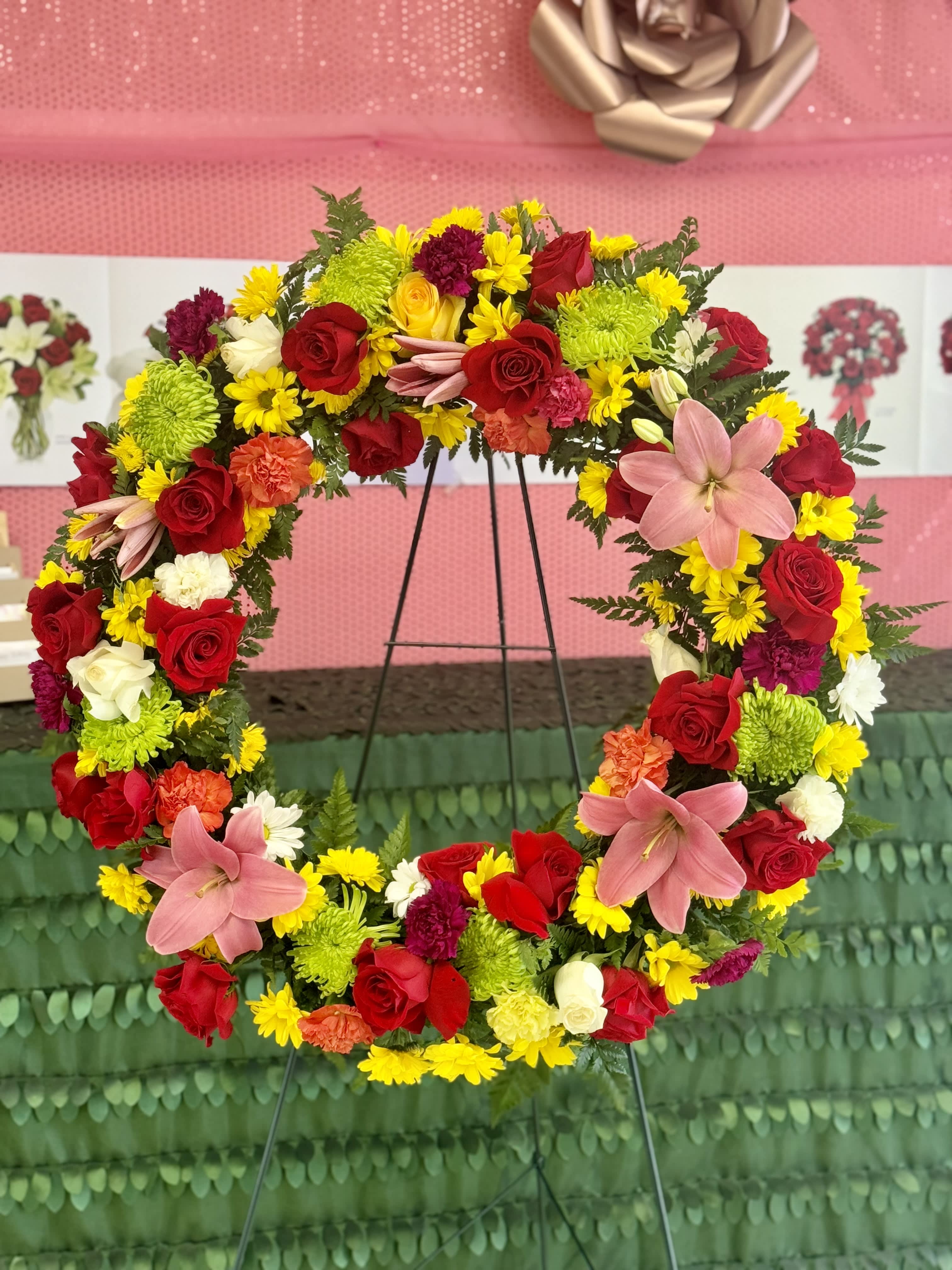 Multi color Wreath Multi color Wreath - Multi color wreath arrange with an array of multi colored florals to help accent wreath. Picture shown is for Premium Price!