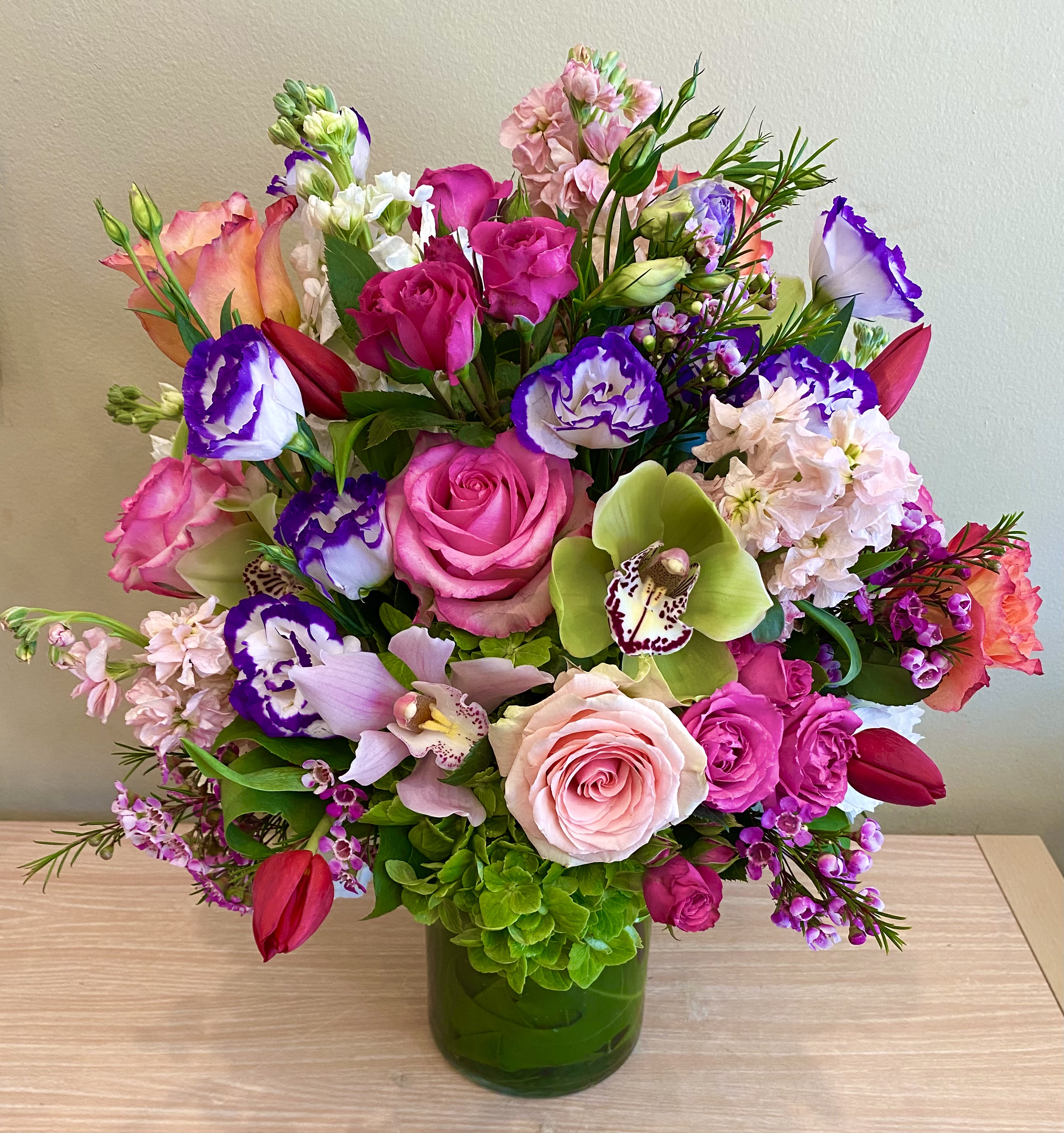 Only You - A lavish garden style ensemble of stock, roses, tulips, lisianthus, hydrangea, etc in a colorful spring mix. Appropriate flower substitutions will be made as per availability, colors and design style will be the same.  Approximately 18-20” tall &amp; wide.