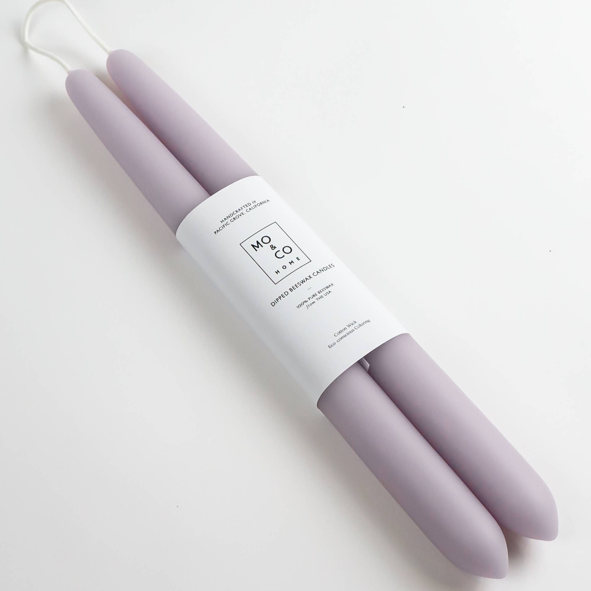 100% Beeswax 14" Dipped Candles | Lavender (Set of 2) 100% Beeswax 14" Dipped Candles | Lavender (Set of 2) - Handcrafted Beeswax Dipped Candles. Sold as a pair. Enjoy the beautiful colors of spring with these handmade candles for home, party, or weddings. Each candle is dipped over 25 times by hand. Ingredients: 100% Beeswax from the USA Cotton Wick Eco-Conscious Coloring Why beeswax? -When burned, beeswax candles emit negative ions that purify the air making it the cleanest burning wax available. -When you purchase beeswax products, you are supporting the bee farmers who colonize and encourage bee reproduction. -Beeswax naturally smells like honey and wildflowers! Made in Pacific Grove, California