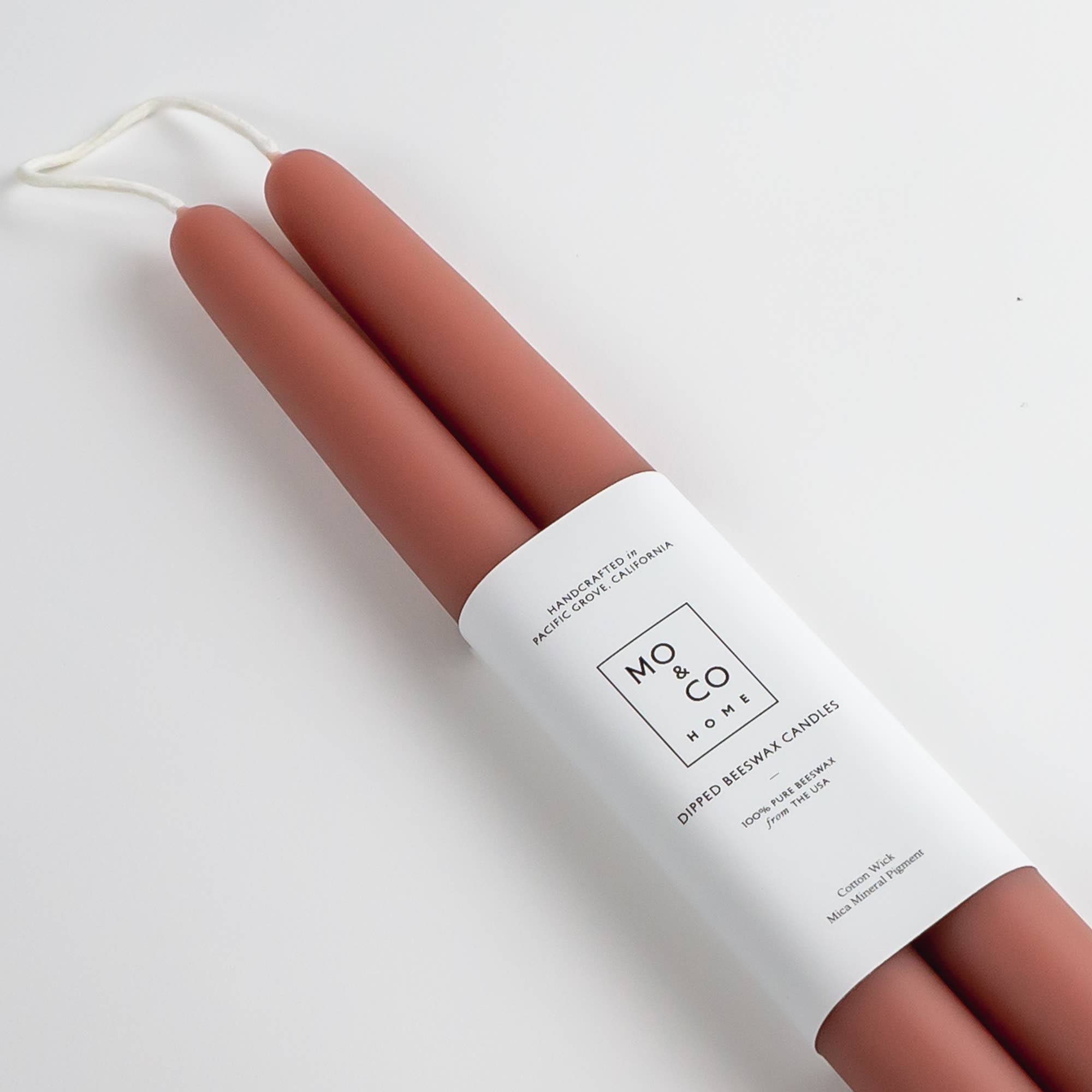 100% Beeswax 14" Dipped Candles | Terra Cotta (Set of 2) 100% Beeswax 14" Dipped Candles | Terra Cotta (Set of 2) - Handcrafted Beeswax Dipped Candles. Sold as a pair. Enjoy the beautiful colors of spring with these handmade candles for home, party, or weddings. Each candle is dipped over 25 times by hand. Ingredients: 100% Beeswax from the USA Cotton Wick Eco-Conscious Coloring Why beeswax? -When burned, beeswax candles emit negative ions that purify the air making it the cleanest burning wax available. -When you purchase beeswax products, you are supporting the bee farmers who colonize and encourage bee reproduction. -Beeswax naturally smells like honey and wildflowers! Made in Pacific Grove, California