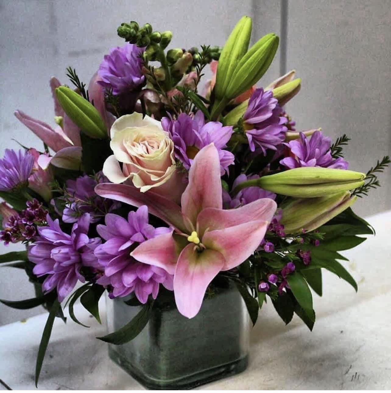Chic Stems - Soft hues of pink and purple make this a perfect bouquet for any girly girl in your life!