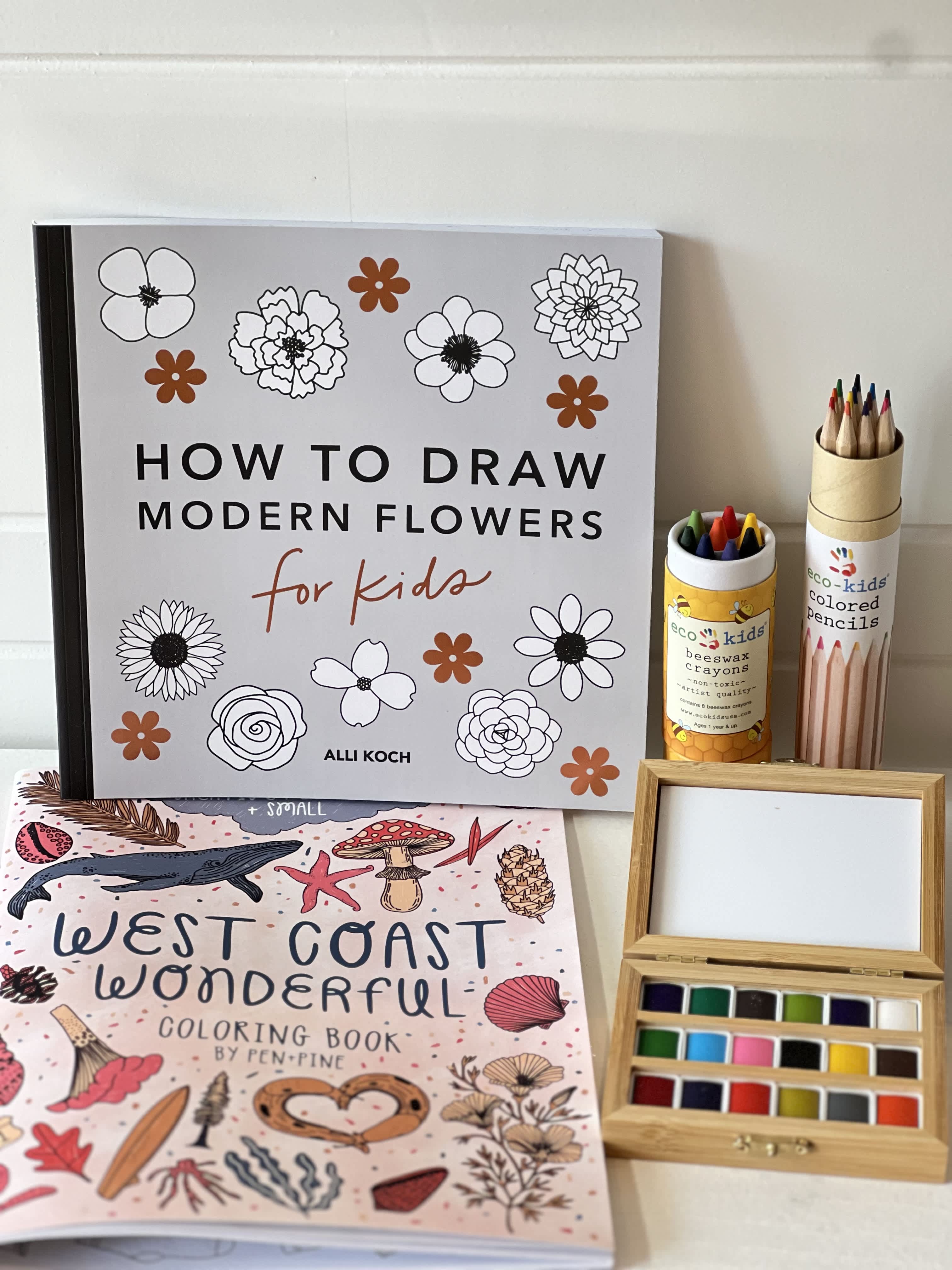 Kids Creative Artist Gift Set Kids Creative Artist Gift Set - Keep your inspired artist creating with this beautifully curated gift set including: - Coloring Book - How To Draw Flowers for kids - Colored Pencils - Crayons - Watercolor Paint Set in Bamboo Box