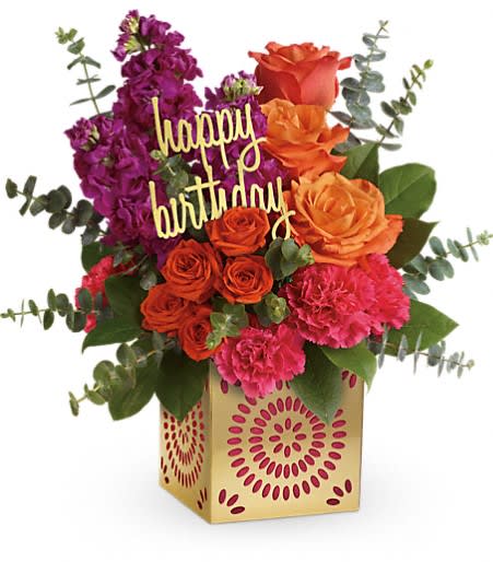 Birthday Sparkle Bouquet - TF - Add some extra special sparkle to their birthday with this grand gift! Hand-delivered in a shimmering golden cube with intricate cutouts, this colorful bouquet will make their birthday week wonderful. Later, they can enjoy the cube as a pretty candle holder! This colorful mix features roses, spray roses, stock, carnations and lush greens. *Cube liner color may vary from picture shown based on availability.