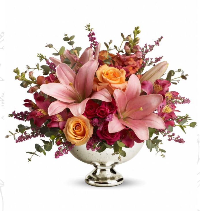 Teleflora's Beauty in Bloom - Bowl someone over with this bounty of beautiful blossoms. Stunning. Spectacular. Stylish. Perfect for any occasion at home or anywhere, there's always room for a bouquet like this!  Light orange roses, hot pink spray roses, pink asiatic lilies and heather, dark pink alstroemeria and lovely orange snapdragons arrive in style. Arrives in an exclusive Mercury Glass Bowl. Blooming beautiful.  Approximately 16&quot; W x 13 1/2&quot; H  Orientation: All-Around      As Shown : T45-1A     Deluxe : T45-1B     Premium : T45-1C  