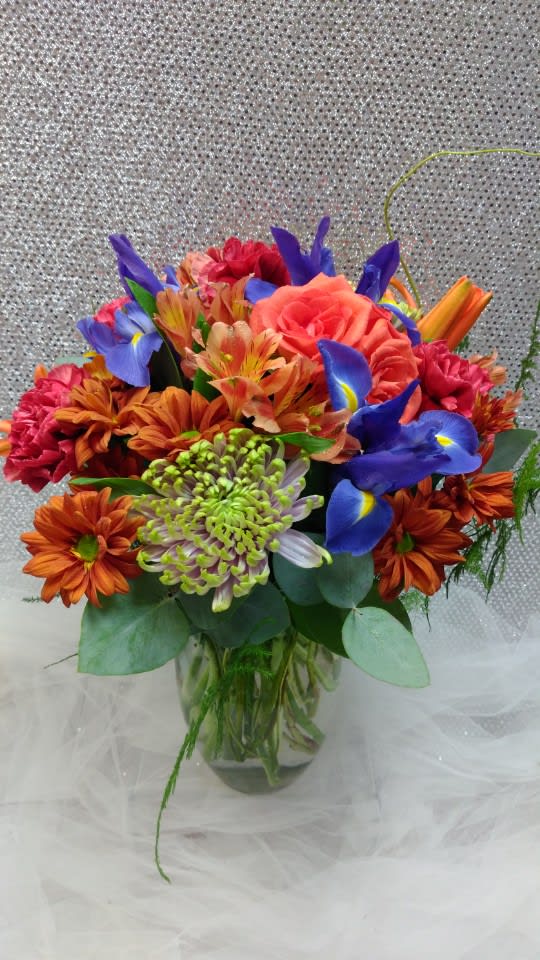 Bright Fall - Includes  Roses,  Lilies,  Mums,  Iris,  Carnations,  Daisy poms, Alstromeria.