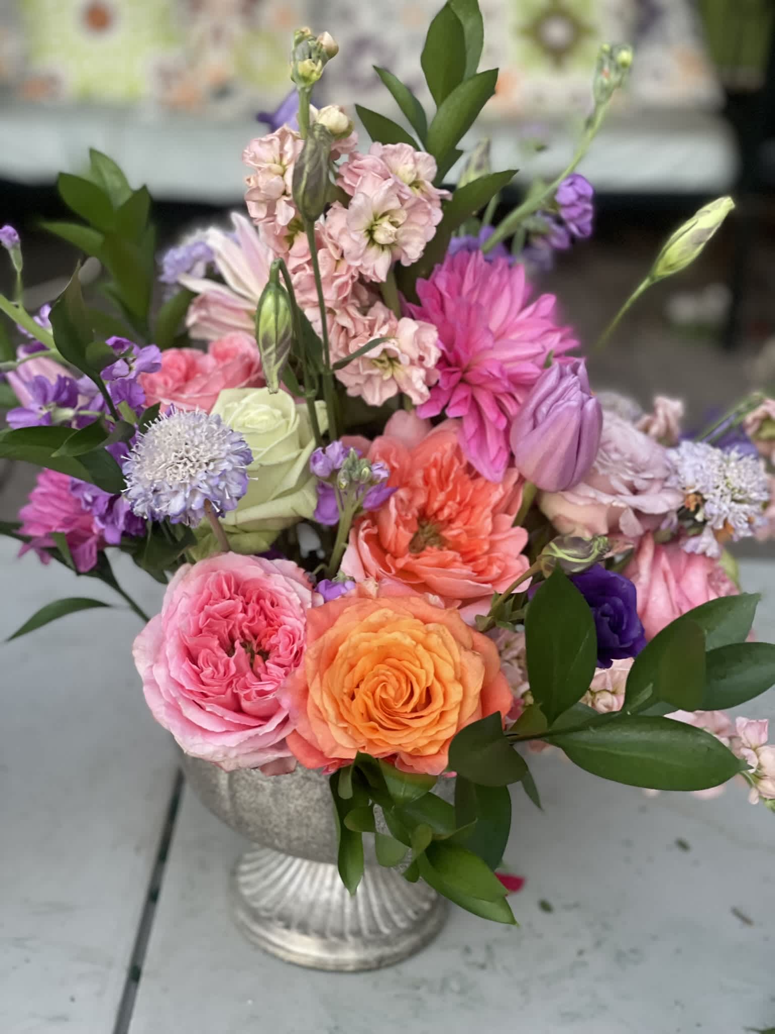 Spring Fling - This bright and colorful combination can be summed up with one word... FUN. The unique shapes of the roses and dahlias play together in a charming way, and the tulips, stock, and scabiosa add a sense of wildness. This color palate is one that can only bring joy.