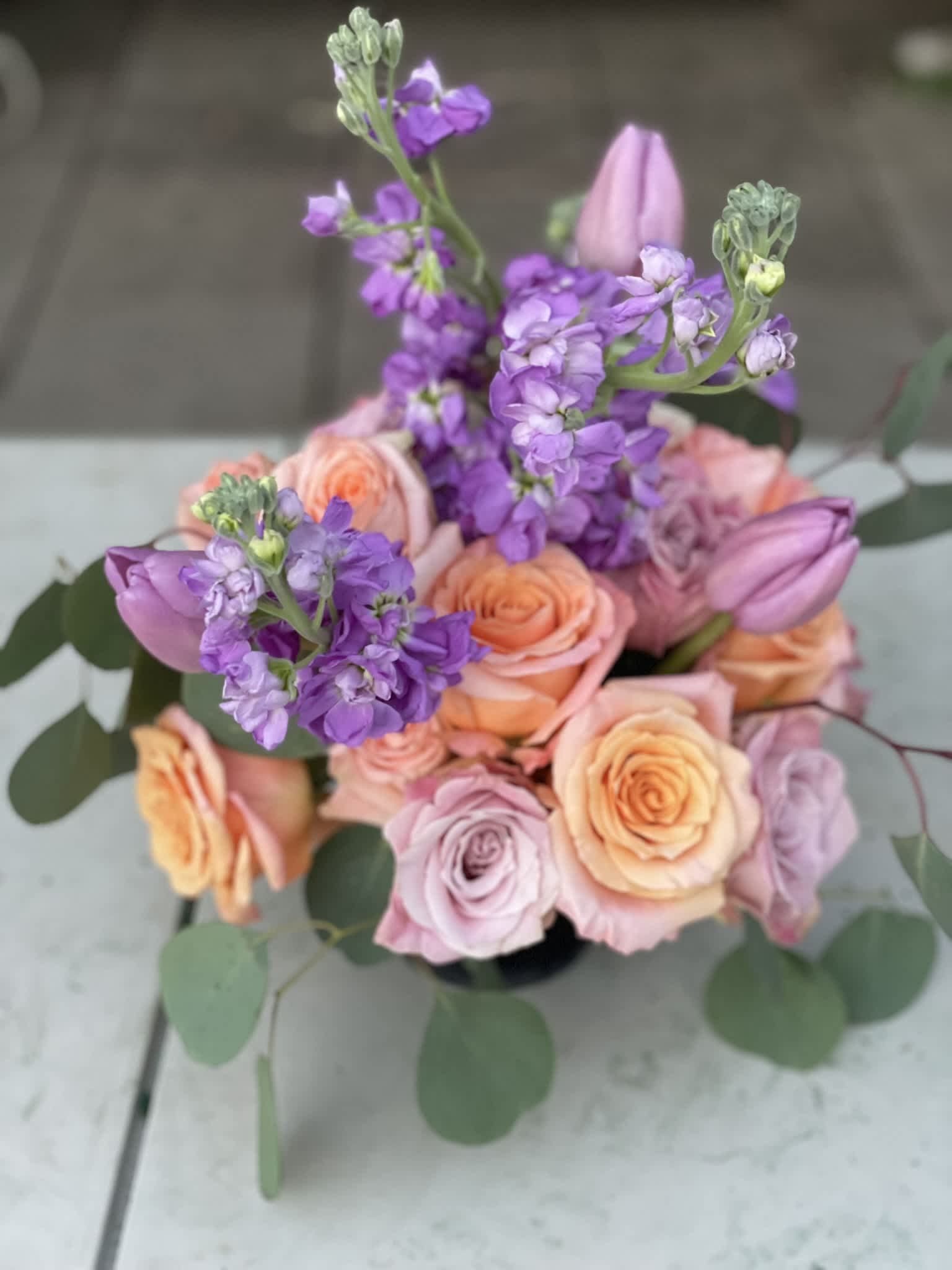 Petit Pastels - This combination of pastel roses, tulips and stock radiate happiness. The soft colors combine to make a powerful show that will brighten up any room or anyone's day!