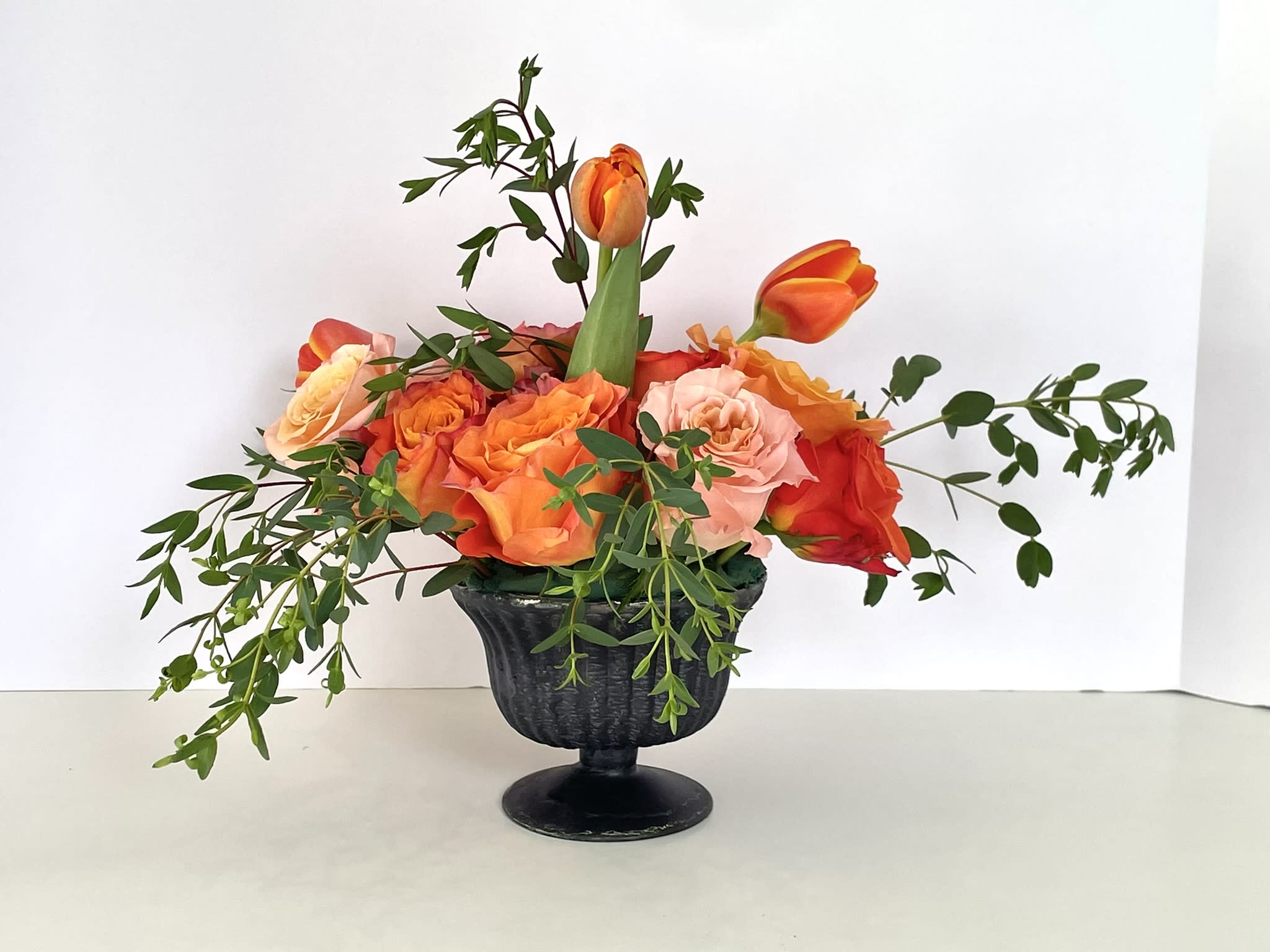 Orange Dream - This combination packs a bold punch, radiating deep orange from every bloom, and capturing the feel of the sun. The roses give it an elegant and full feel, while the gorgeous orange tulips burst forth, giving it a sense of motion and joy. 