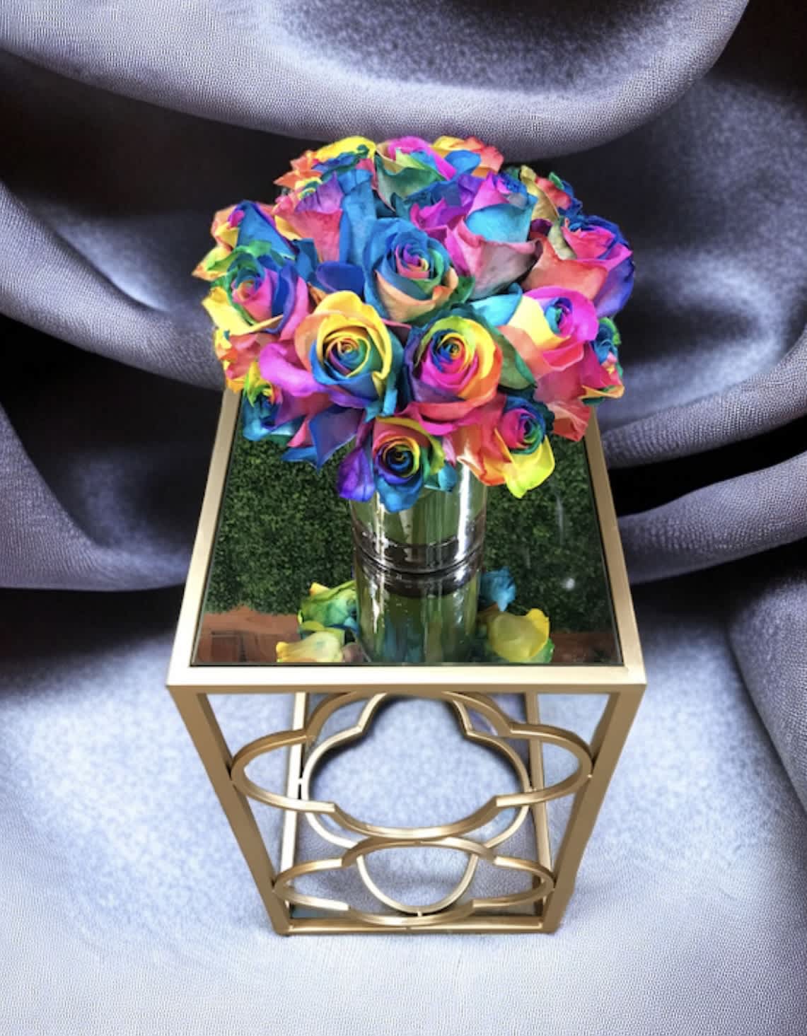 You and my rainbow - This arrangement rests within a ti leaf lined 5” by 5” glass vase with rainbow roses