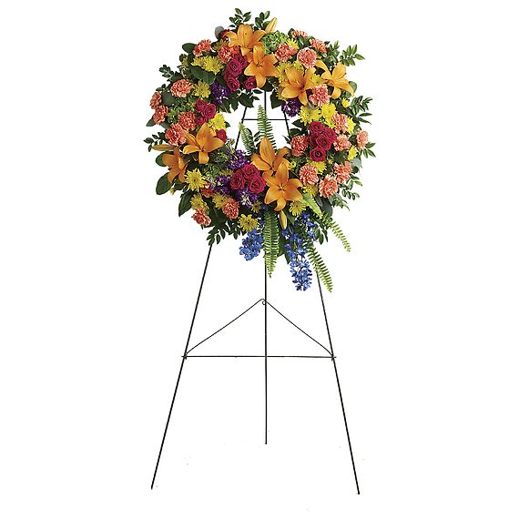 COLORFUL SERENITY WREATH COLORFUL SERENITY WREATH - Like a beacon of love and hope, this glorious wreath of hydrangea, roses and lilies echoes the joy of your precious memories. 18" wreath