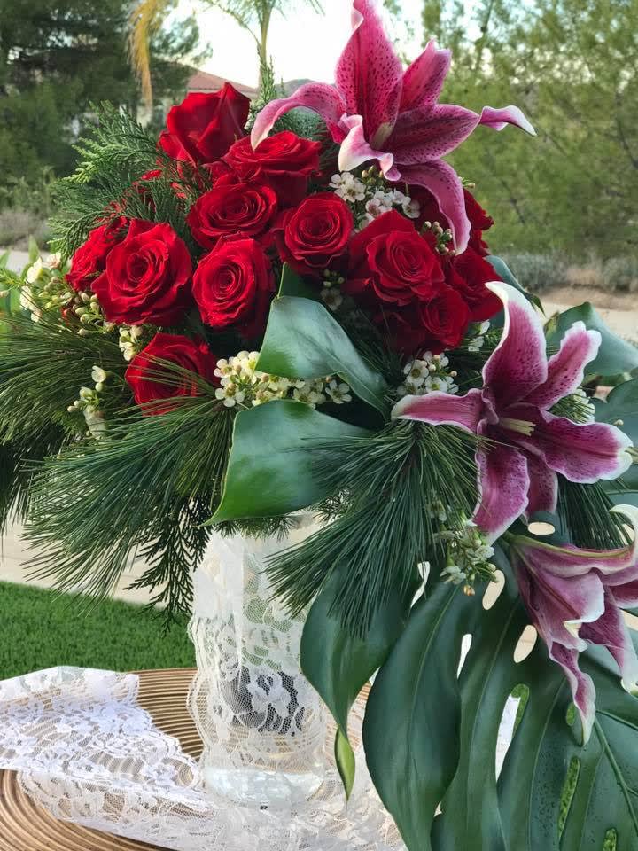 Red Rose and Lily Cascade Bouquet - Red Rose and Lily Cascade Bouquet  will bring passion in style.   In some instances, our photo may represent an overall theme or look and include a one-of-a-kind vase which cannot be exactly replicated.  Although the actual bouquet may not precisely match the photo, its temperament will. Occasionally, substitutions of flowers and/or containers happen due to weather, seasonality and market conditions which may affect availability. If this is the case with the gift you’ve selected, we will ensure that the style, theme and color scheme of your arrangement is preserved and will only substitute items of equal value or higher value.  DELIVERY TIMES ARE USUALLY BETWEEN 2:30 PM THROUGH 6:30PM ON THE DAY OF DELIVERY. FOR SAME DAY ORDERS, PLEASE GIVE US AT LEAST 6 HOURS TO PROCESS AND DELIVER THE FLOWERS AS PRIOR ORDERS WILL BE PRIORITIZED. MORNING DELIVERY REQUESTS AND SPECIFIC TIME REQUESTS WILL BE AN ADDITIONAL $15 FOR A CONVENIENCE FEE CHARGE. OTHERWISE, SPECIFIC TIMES ARE ACKNOWLEDGED AND WE WILL DO OUR BEST TO ACCOMMODATE, HOWEVER WE CANNOT GUARANTEE ON TIME DELIVERY. GATE CODES ARE MANDATORY FOR OUR DELIVERY DRIVERS TO BE ABLE TO ENTER RESIDENTIAL OR COMMERCIAL BUILDINGS. IF YOU DON’T KNOW THE GATE CODE FOR A DELIVERY, PLEASE CONTACT THE RECIPIENT AND PROVIDE US WITH IT OR OUR DRIVER CAN CONTACT THE RECIPIENT BEFORE BEGINNING A DELIVERY ROUTE TO OBTAIN THE CODE. OUR POLICY STATES THAT DRIVERS WILL ONLY WAIT FIVE MINUTES OUTSIDE THE GATE FOR A CALLBACK. IF A DRIVER HAS TO LEAVE A PROPERTY, THE DELIVERY IS REASSIGNED FOR THE NEXT DAY AND MAY CHARGE AN ADDITIONAL DELIVERY FEE. THANK YOU FOR YOUR BUSINESS.