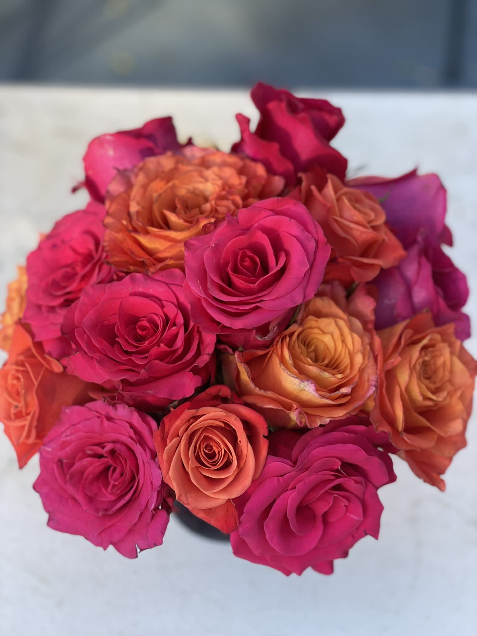 Hot Pink &amp; Orange Crush - The simple elegance of this compact arrangement is striking, but the bold oranges and hot pink really make this little combination a crowd pleaser and an eye-catching addition to any home or party