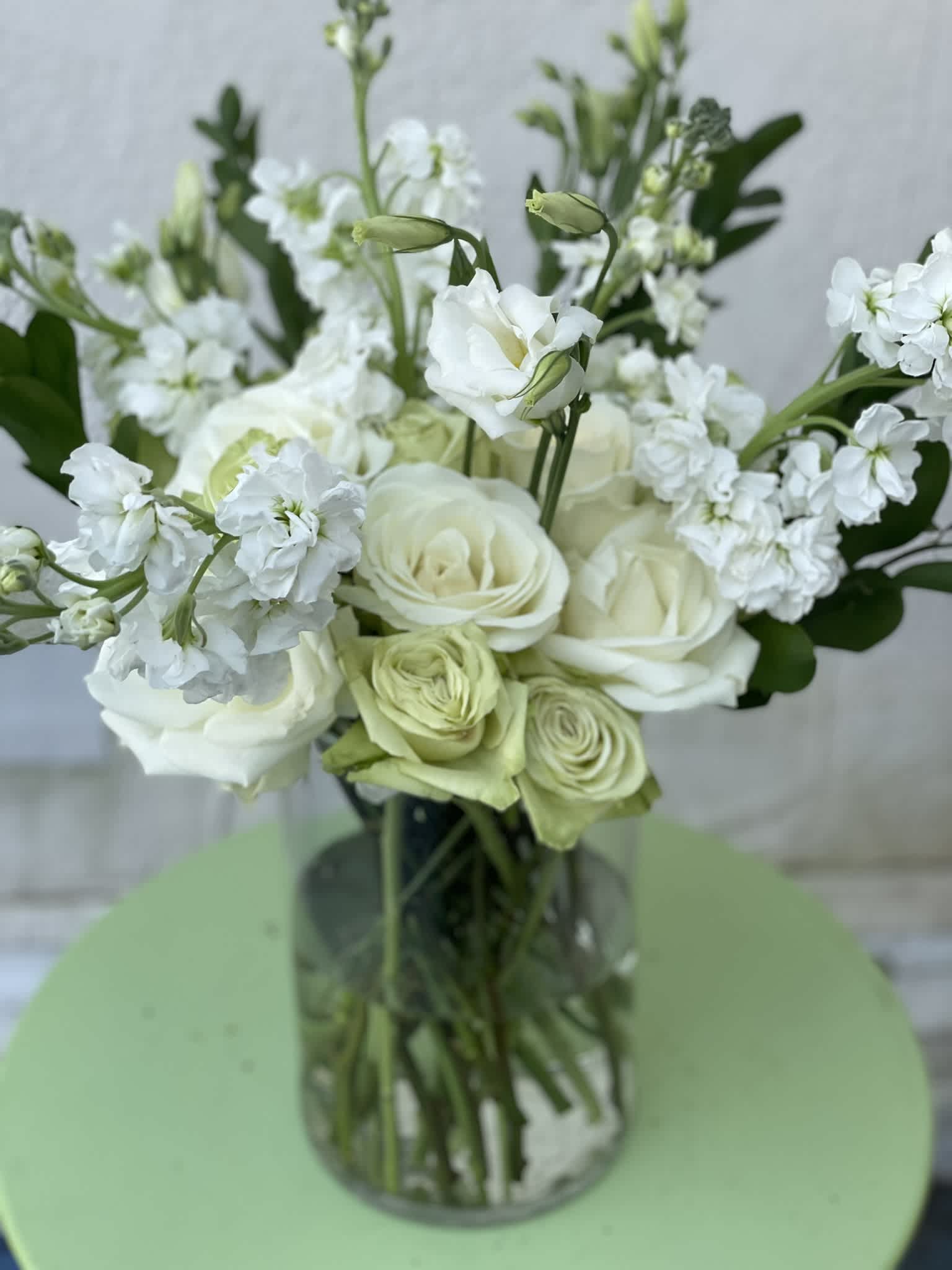 White &amp; Green Dream - This classic combination of green and white is as elegant as it is fresh. The textures and tones of green and white roses make a gorgeous and calming display and the lisianthus and stock give it a new free-flowing feel.